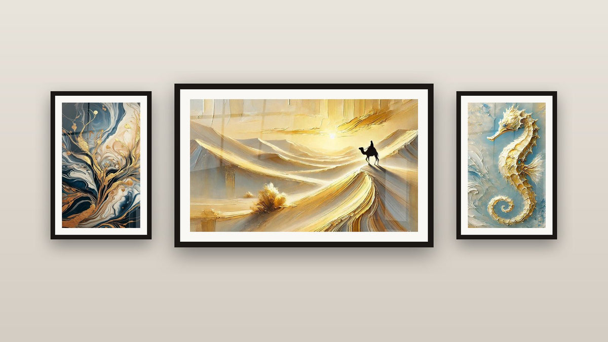 Gallery wall with three framed paintings: The Gold of the Abyss, Fluid Golden Trees Abstract and Solitude of the Dunes
