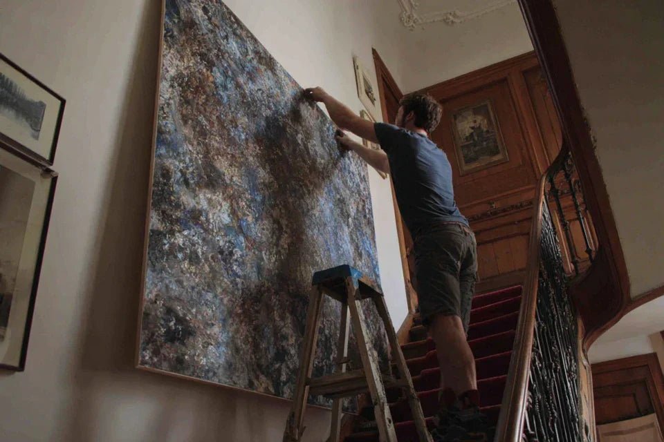 Fixer plusieurs tableaux en ligne droite sans niveau laser : méthode visuelle