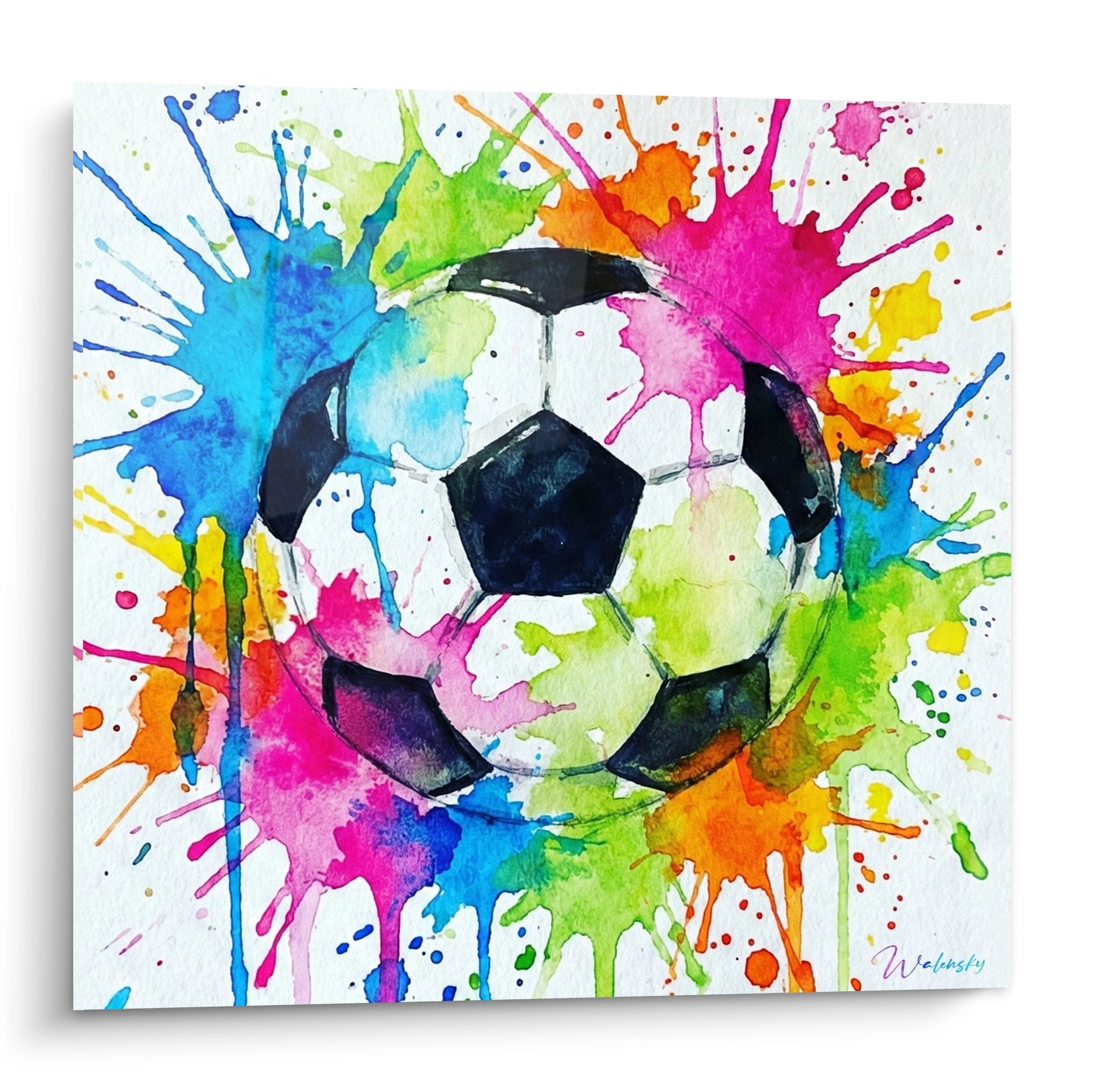 Tableau football moderne avec ballon noir et blanc au centre d'une explosion de couleurs aquarelle vives