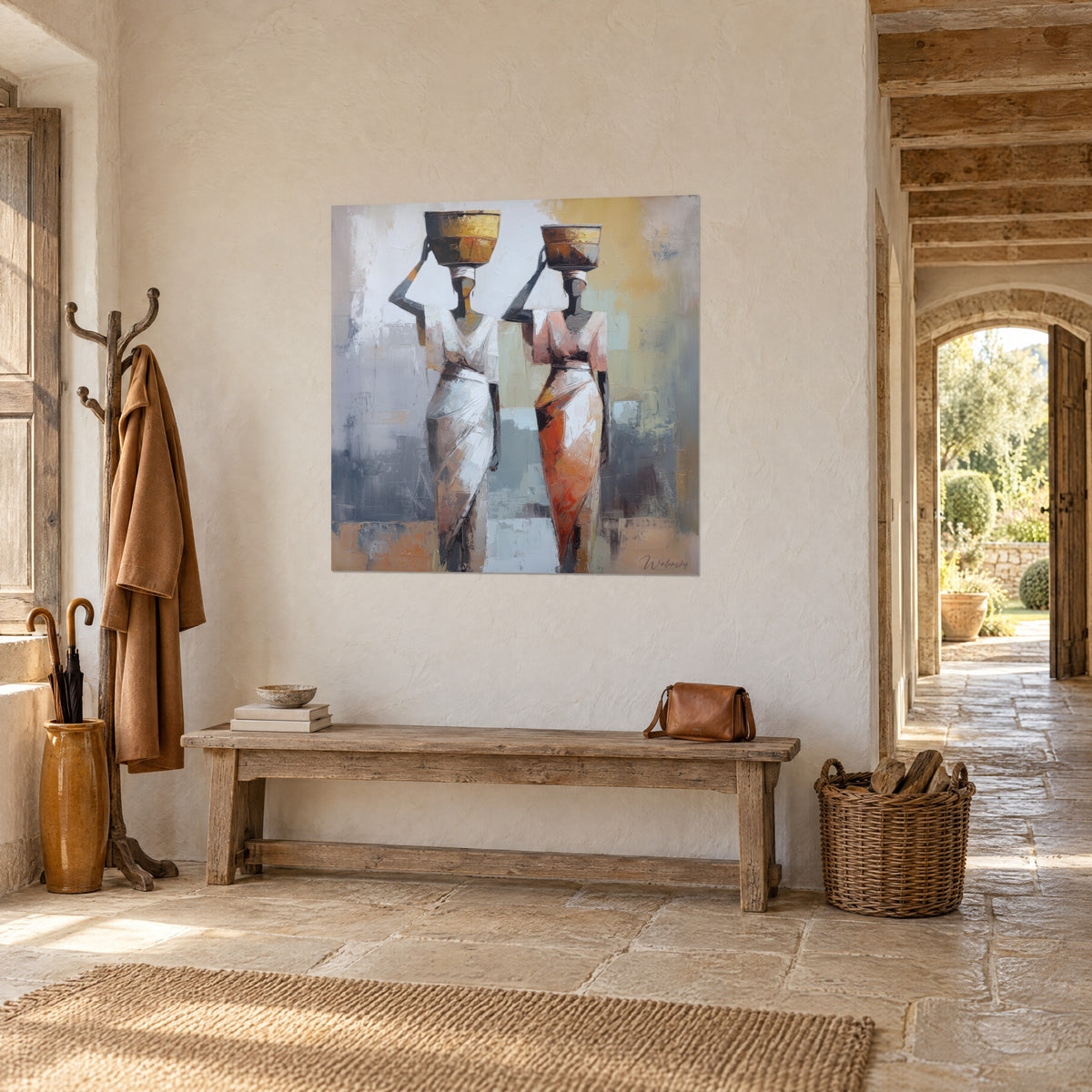 Wall art African women in ivory and burnt orange saris, arm raised toward the jar, grey-blue background, in a stone hall
