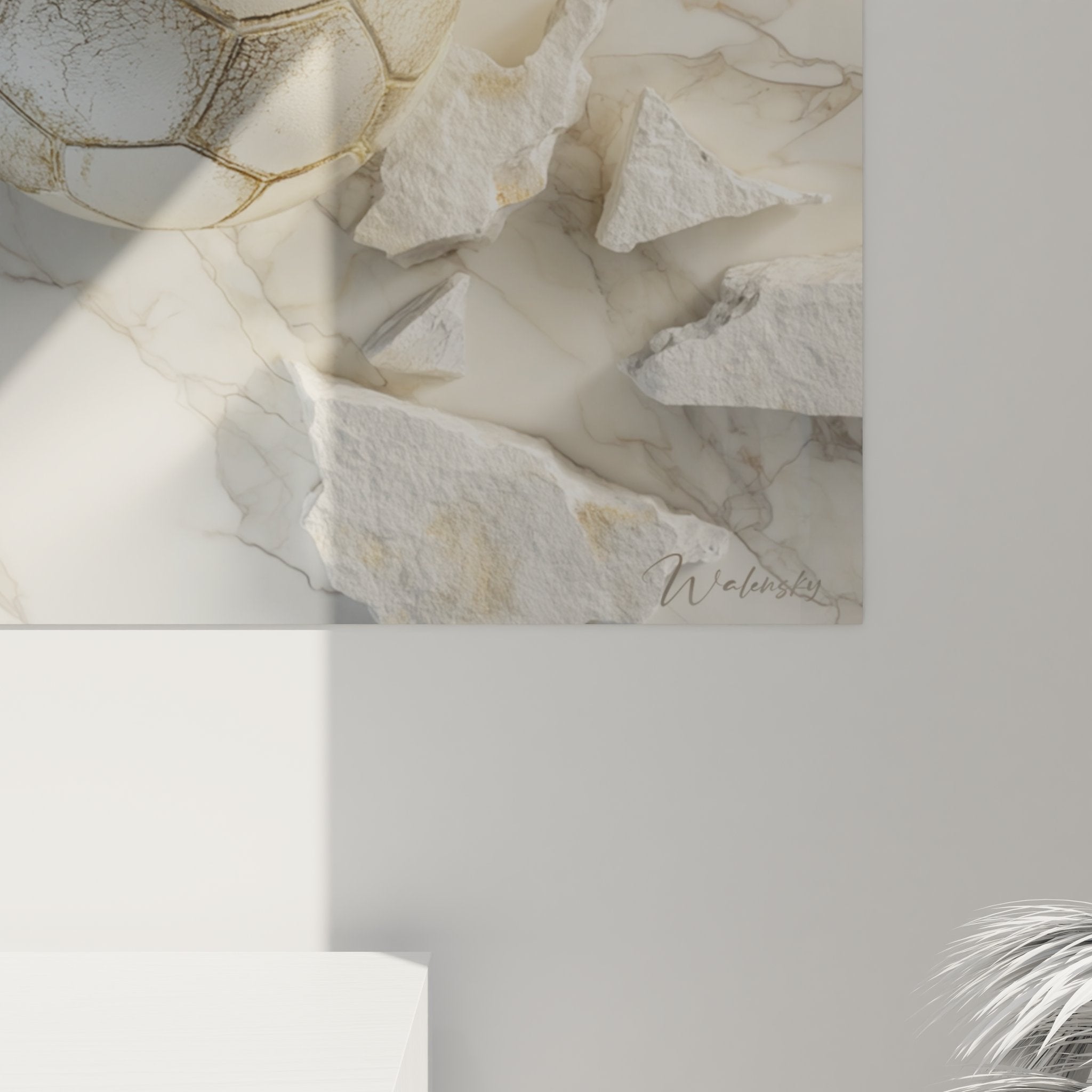 Vue d'ensemble tableau football marbre blanc, ballon doré central entouré débris pierre naturelle