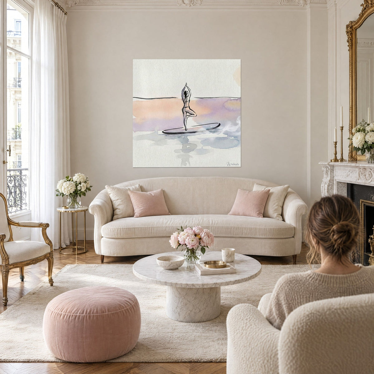 Wall art yogi in tree pose on her board, peach and lilac watercolor, woman from behind, above a sofa in a bright living room