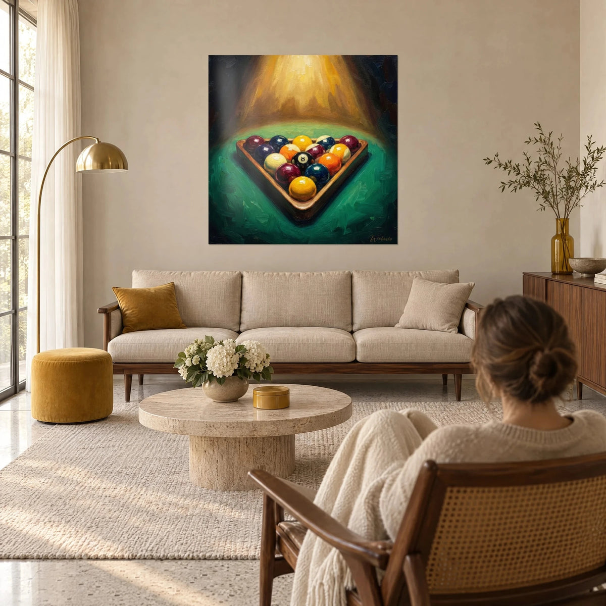 Wall art billiard balls racked in a triangle, yellow and burgundy, on green baize, above a sofa in a bright living room
