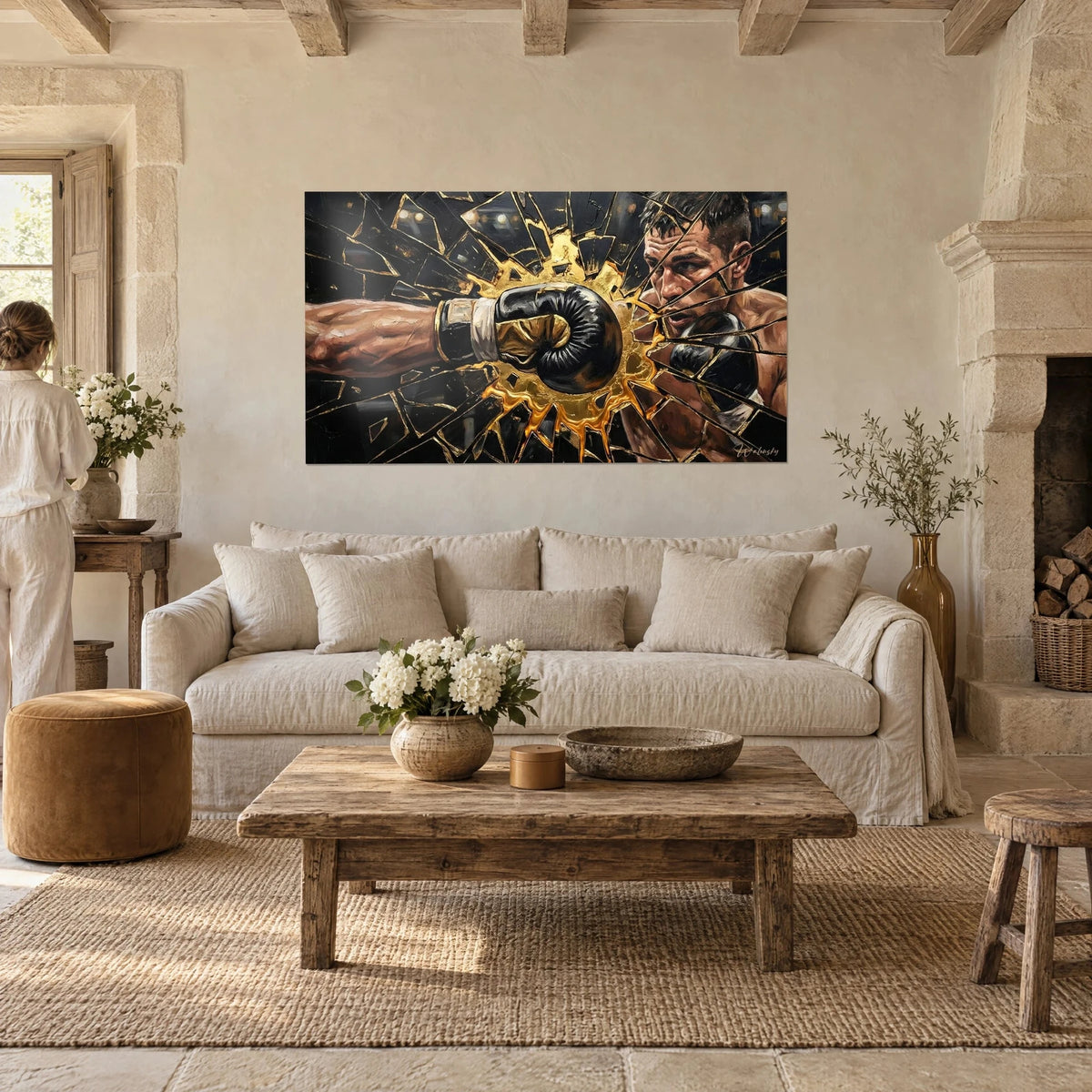 Wall art of a black-gloved fist shattering a mirror, golden shards and boxer's face, above a sofa in a bright living room
