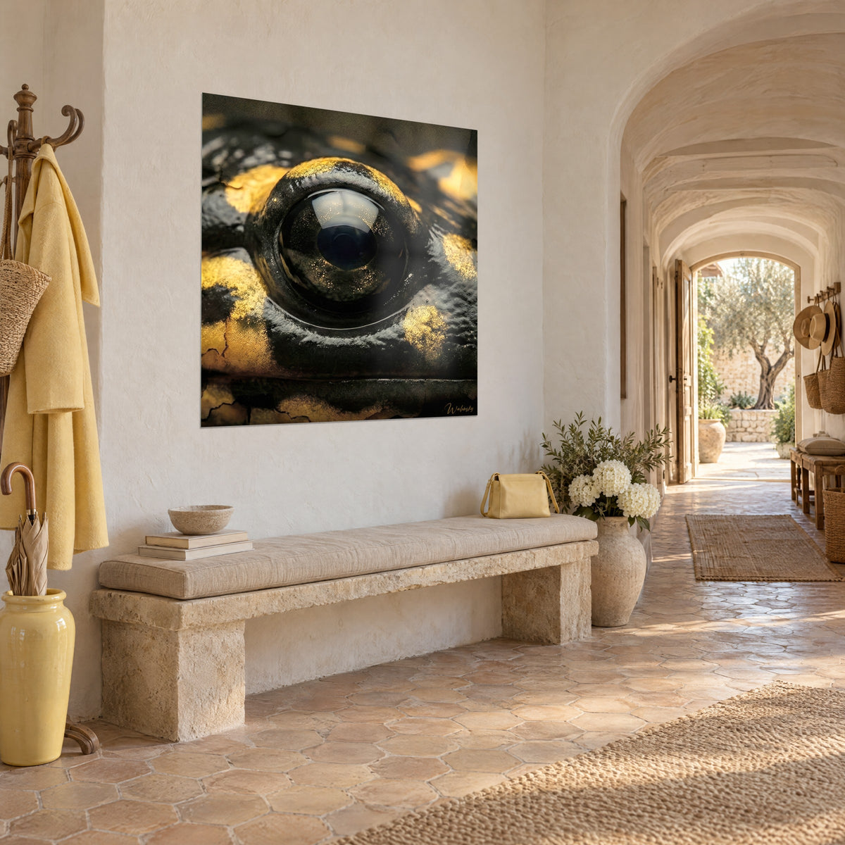 Wall art hypnotic gaze of an amphibian, ebony iris ringed with gold and black, three-quarter view in the vaulted entrance of a Provençal farmhouse