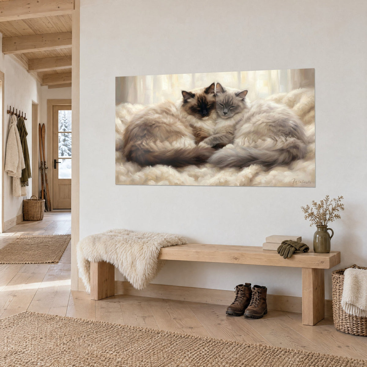 Tableau félins ragdoll blottis front contre front, poils beige miel et gris bleuté, banc en bois clair dans une entrée de chalet