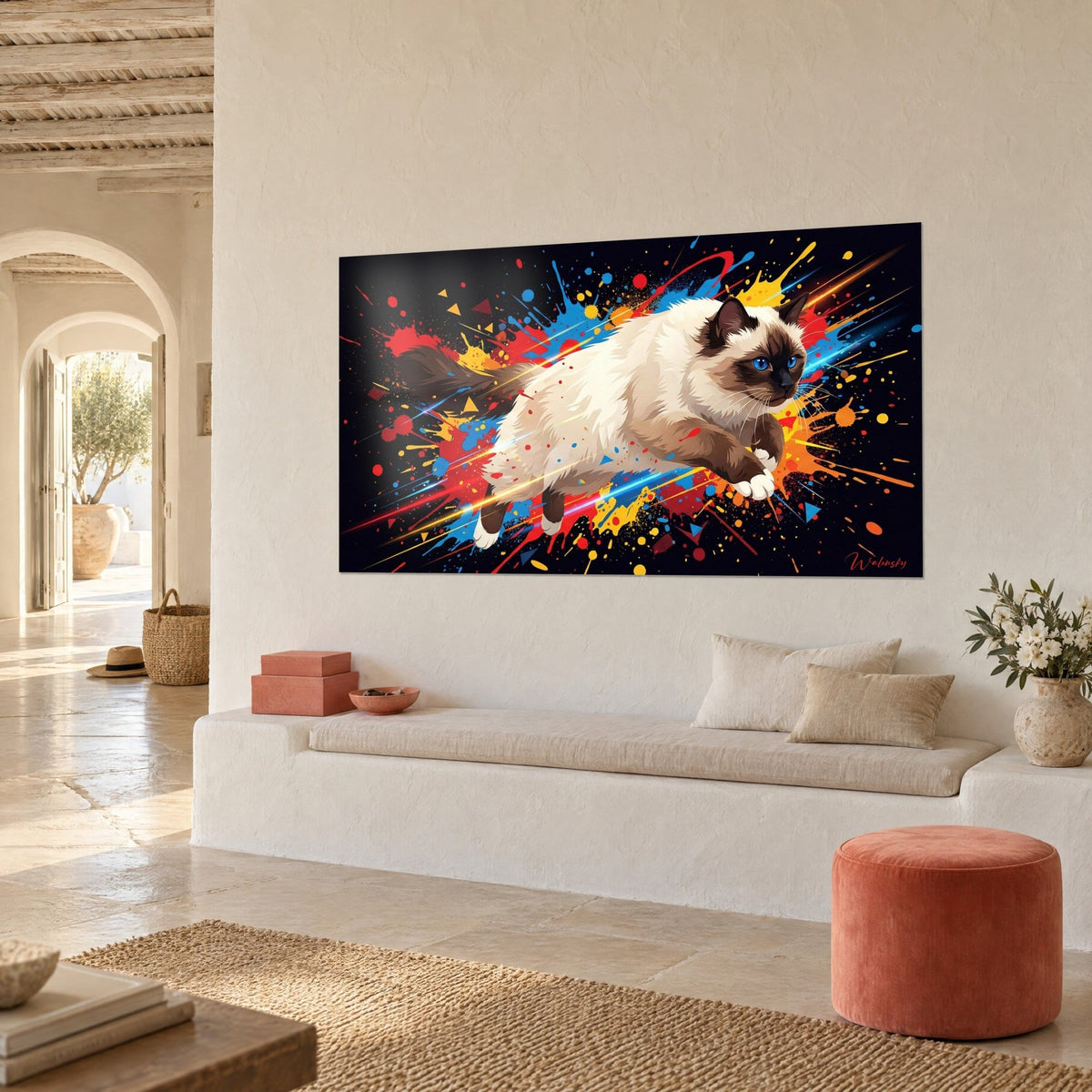 Wall art of a blue-eyed feline in mid-leap, yellow and orange flecks on a black background, off-white wall of a Mediterranean house