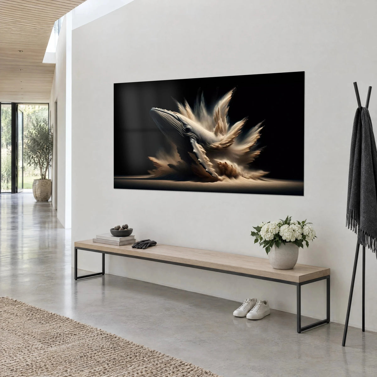 Wall art of a whale sculpted from cream sand, golden burst on a deep black background, three-quarter view in an architect-designed living room