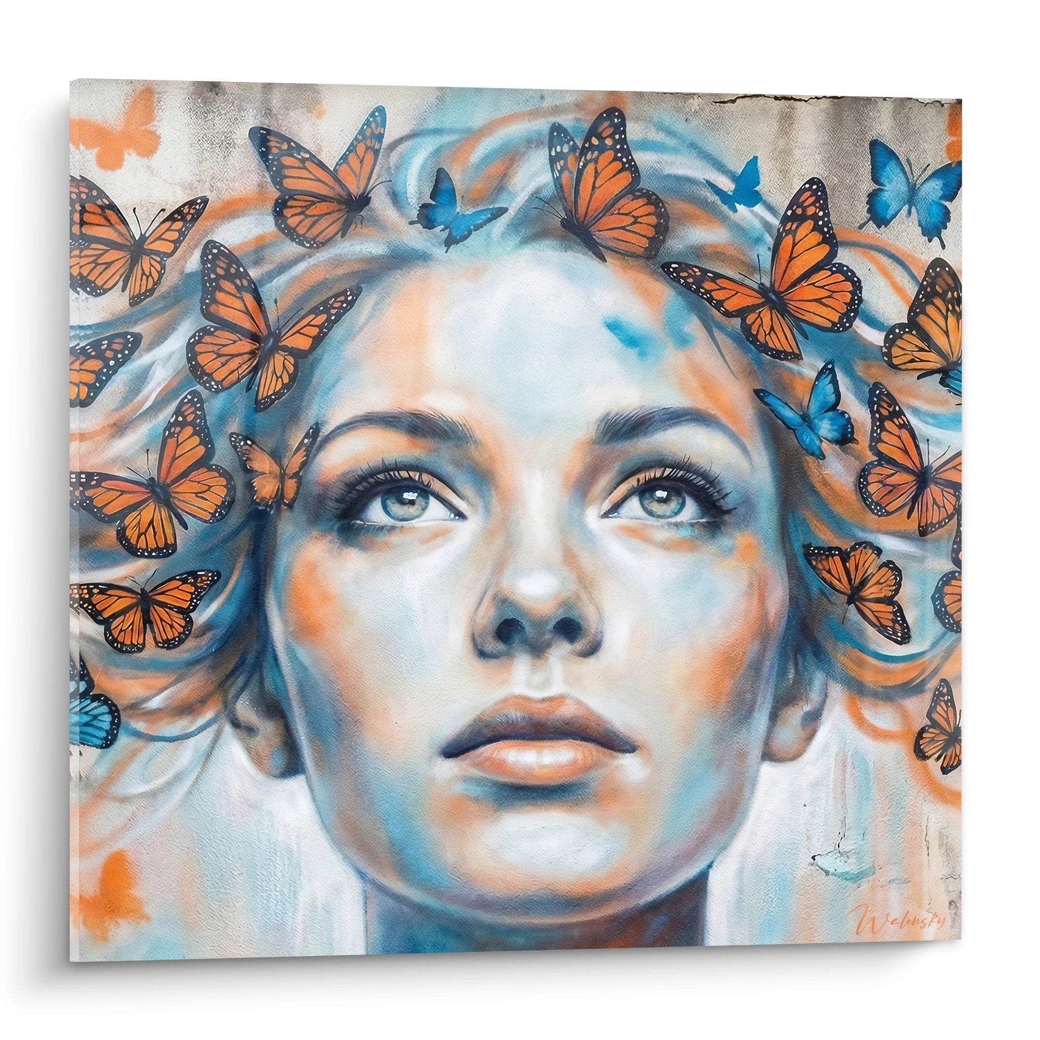 Portrait street art femme papillons orange bleu regard intense decoration murale moderne