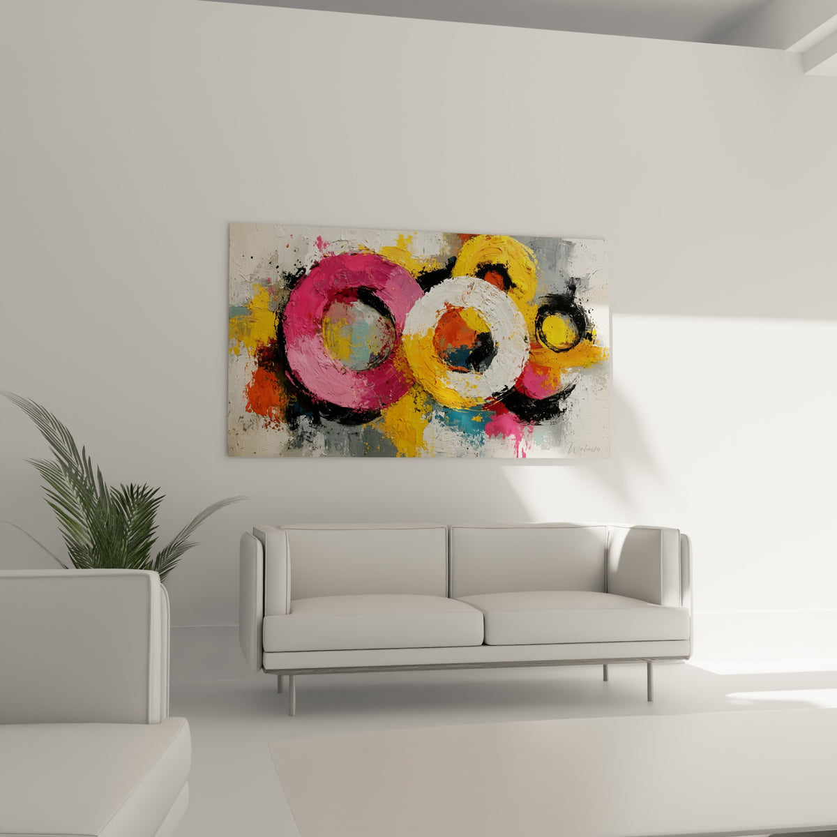 Trois cercles colorés rose et blanc positionnés au-dessus d'un canapé dans un salon lumineux