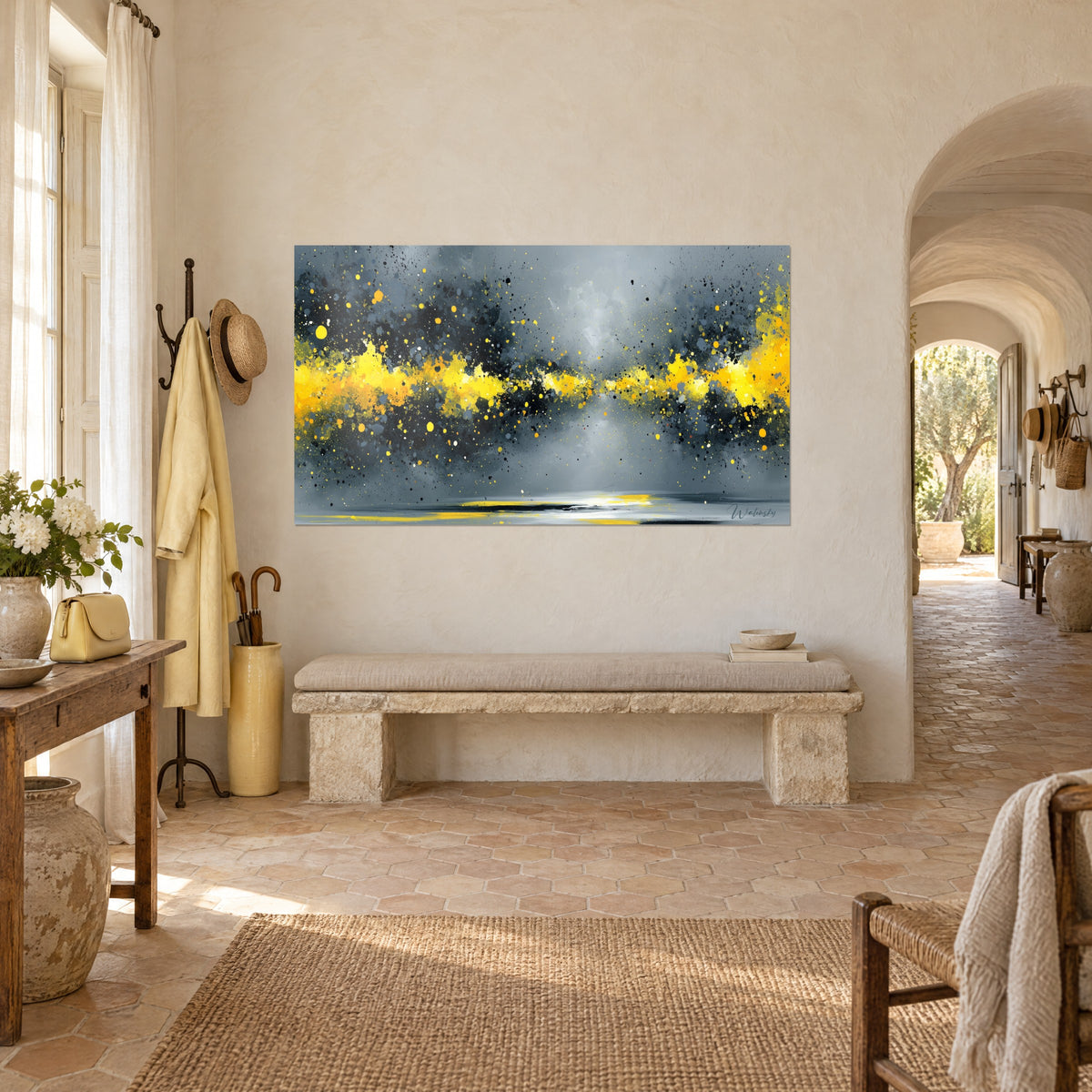 Wall art with lemon and charcoal black splashes on a stormy grey sky, seen three-quarters in a Provençal farmhouse