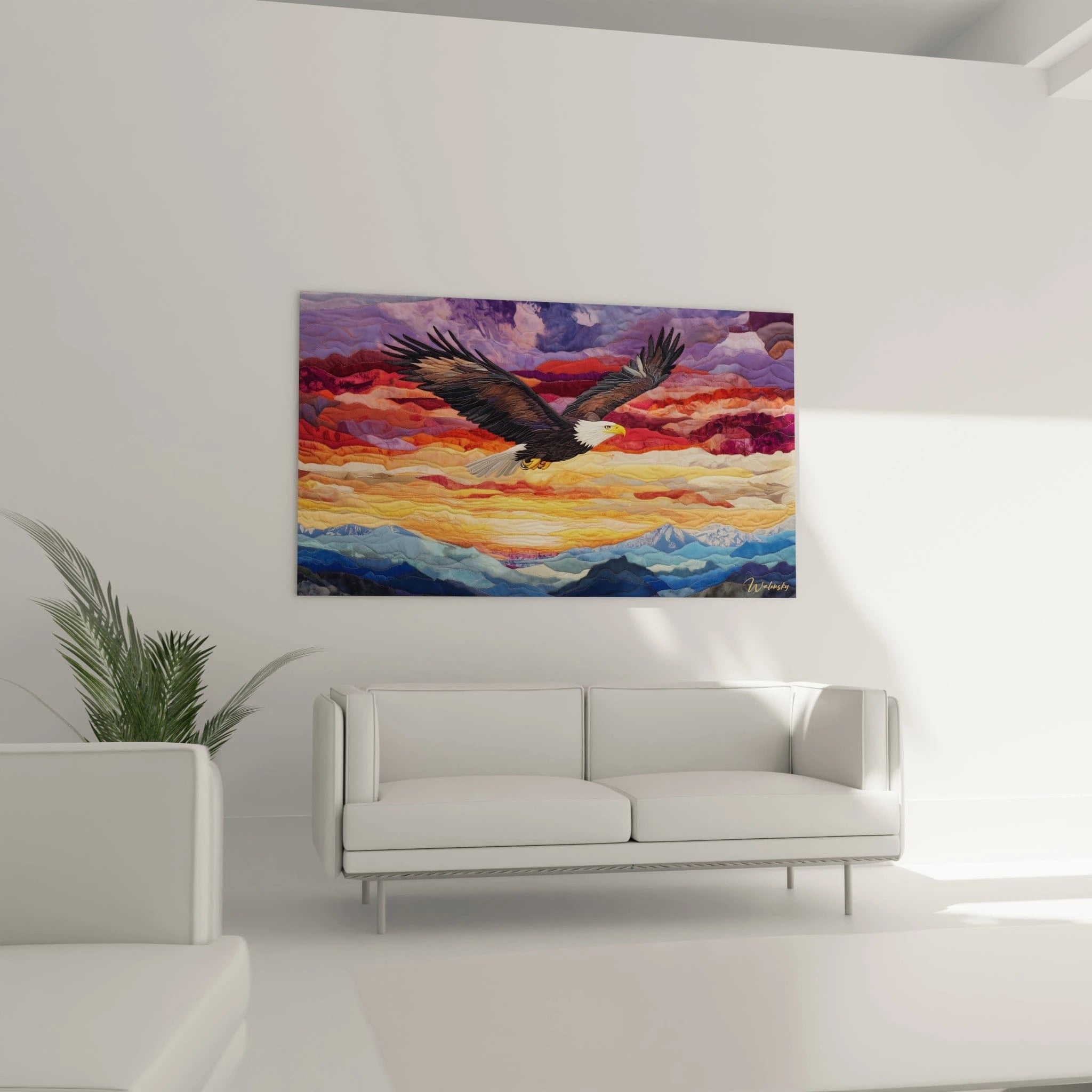 Un tableau textile présentant un aigle américain en vol, détaillé avec précision, surplombant un paysage abstrait composé de couches ondulantes dans des dégradés de bleu, orange, rouge et pourpre, créant une impression de mouvement et de profondeur.