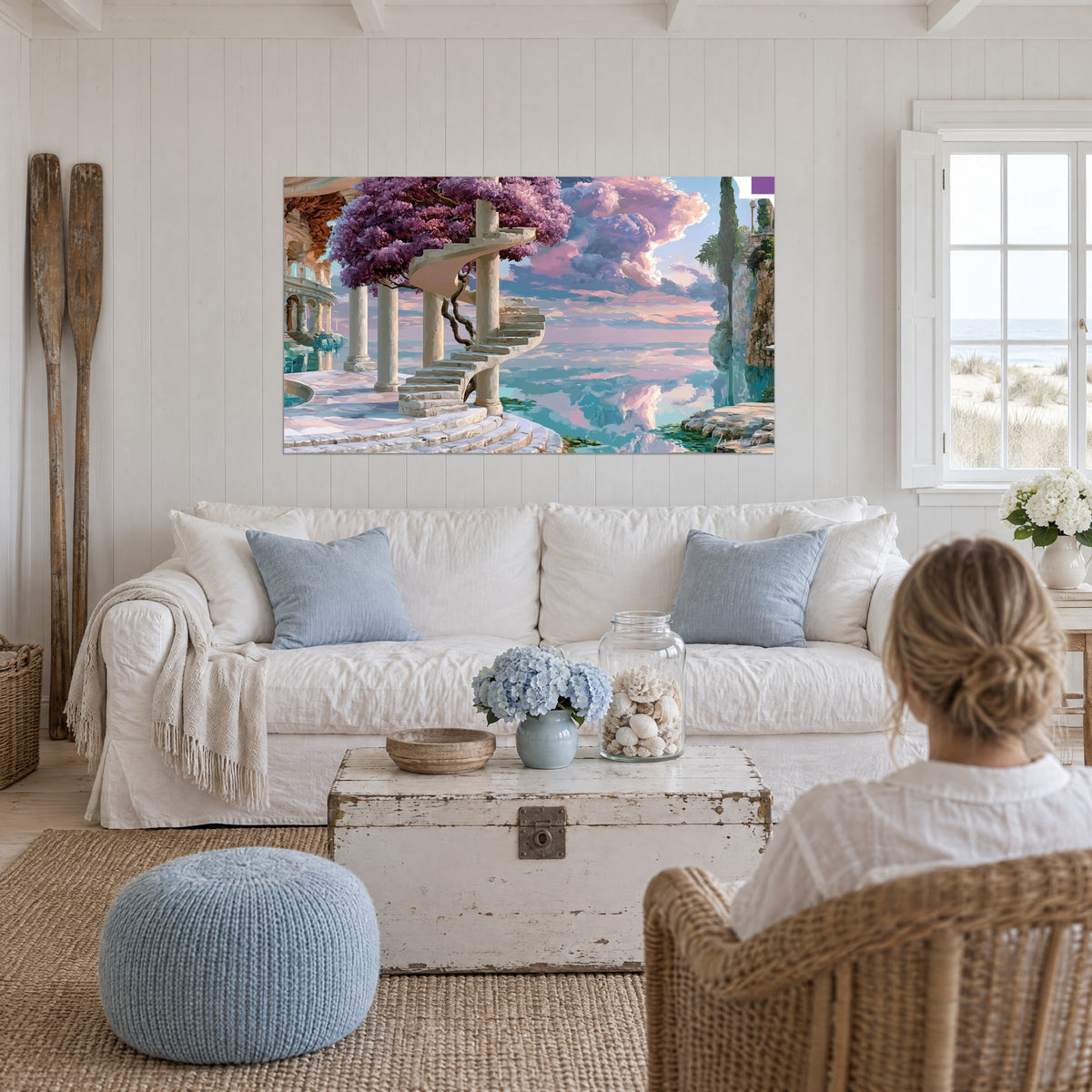 Gemälde Wendeltreppe aus weißem Stein unter lila Glyzinie, rosa und türkisfarbener Himmel, über einem Sofa in einem hellen Wohnzimmer