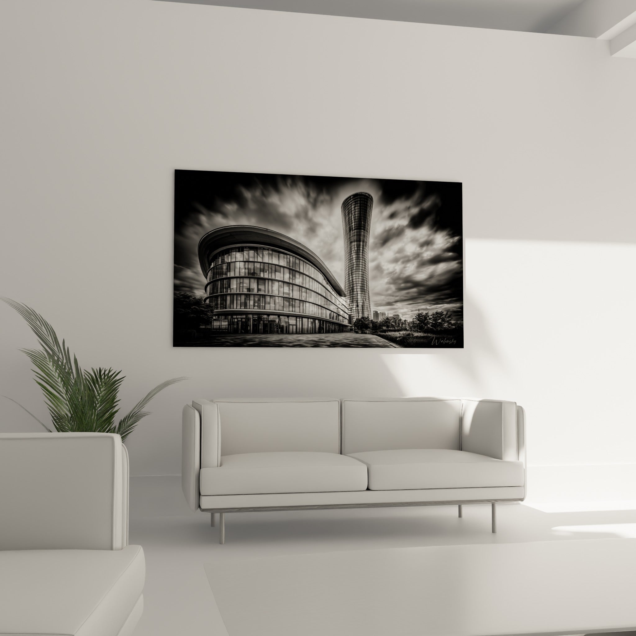 Bâtiment courbe vitré et tour élancée en noir et blanc au-dessus d'un canapé dans un salon lumineux