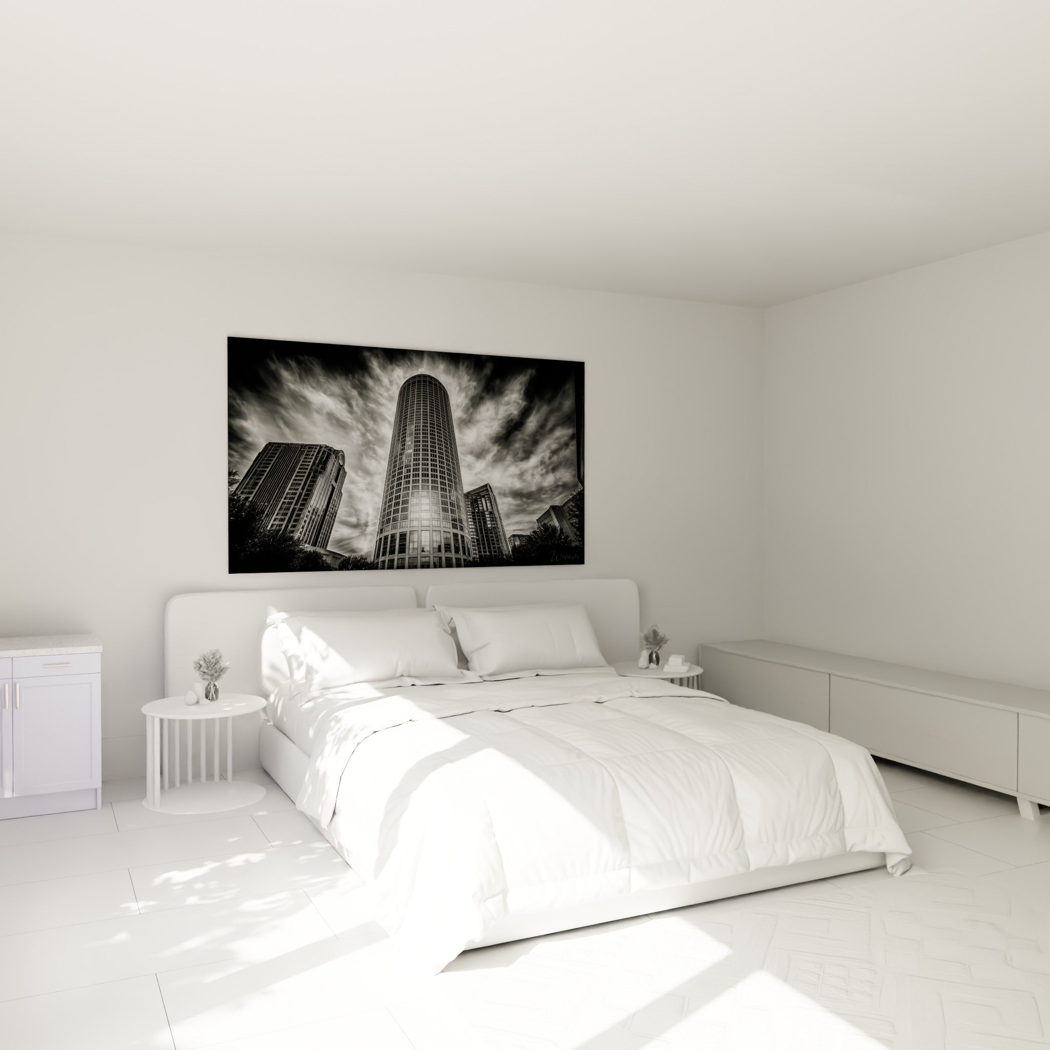 Tour urbaine grise et blanche en contre-plongée, accrochée au-dessus d'un lit dans une chambre claire