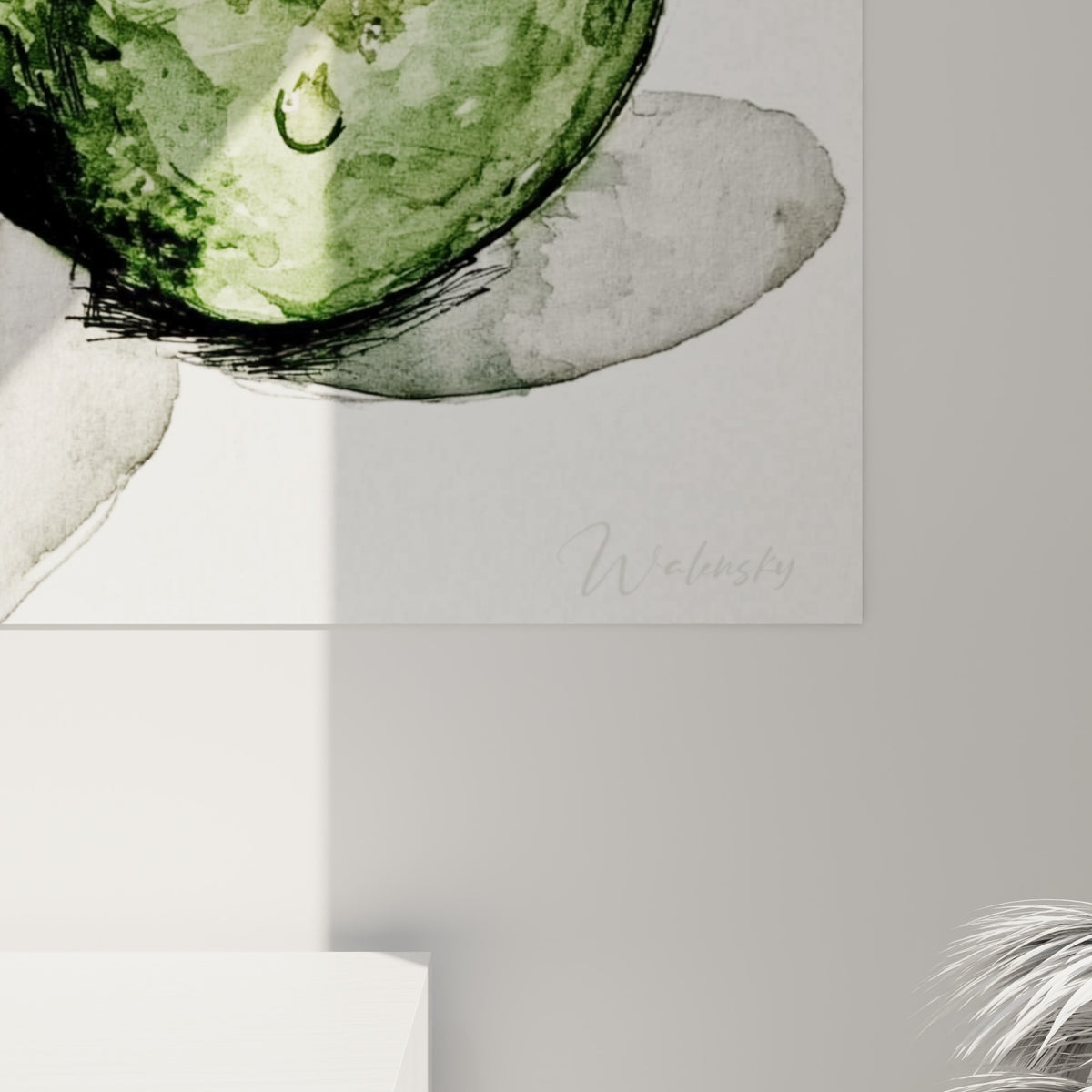 Détail des coulures aquarelle vert olive et brun chocolat sur la chair et le noyau de l'avocat peint