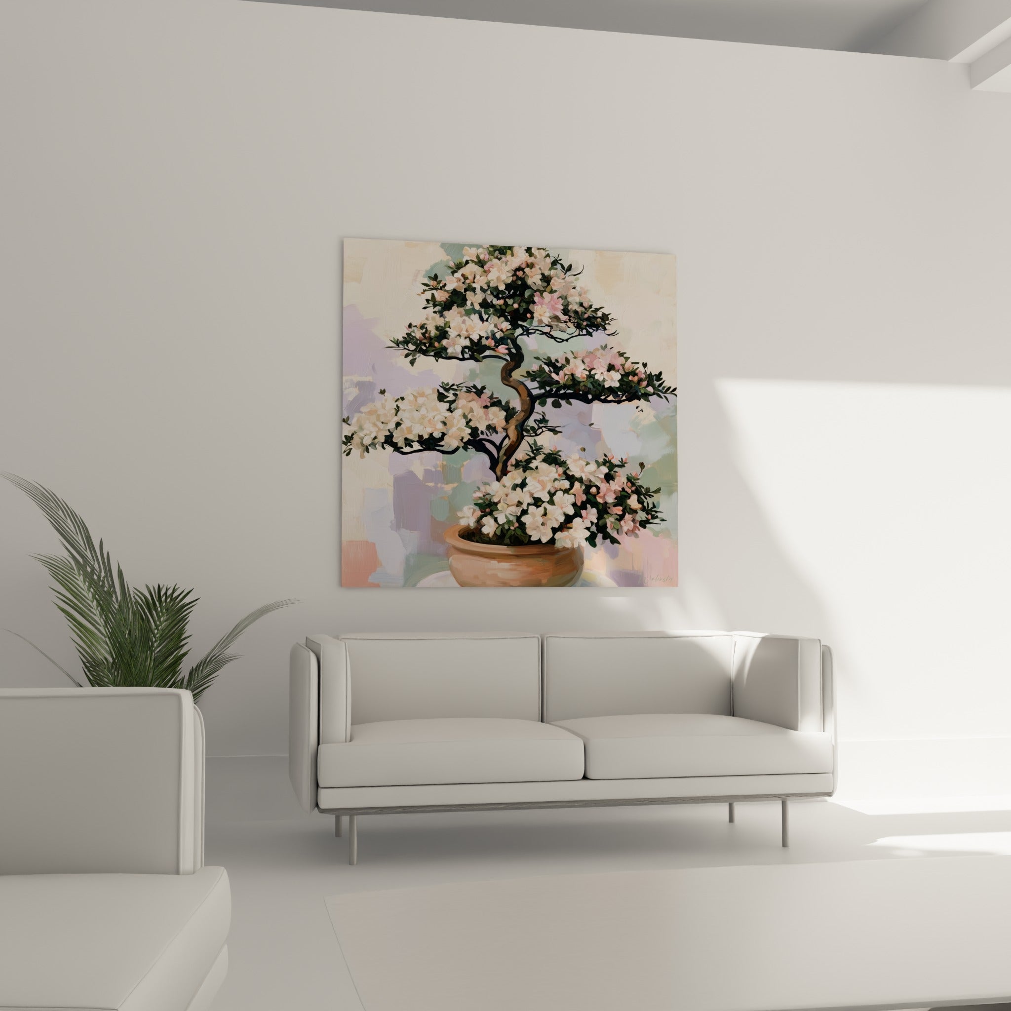 Bonsaï azalée aux fleurs blanches et roses dans un pot terracotta, au-dessus d'un canapé dans un salon lumineux