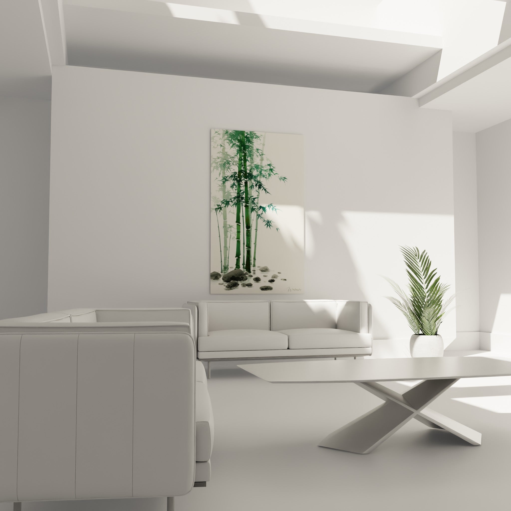 Feuillage de bambou vert sauge et pierres anthracite installés au-dessus d'un canapé dans un salon lumineux