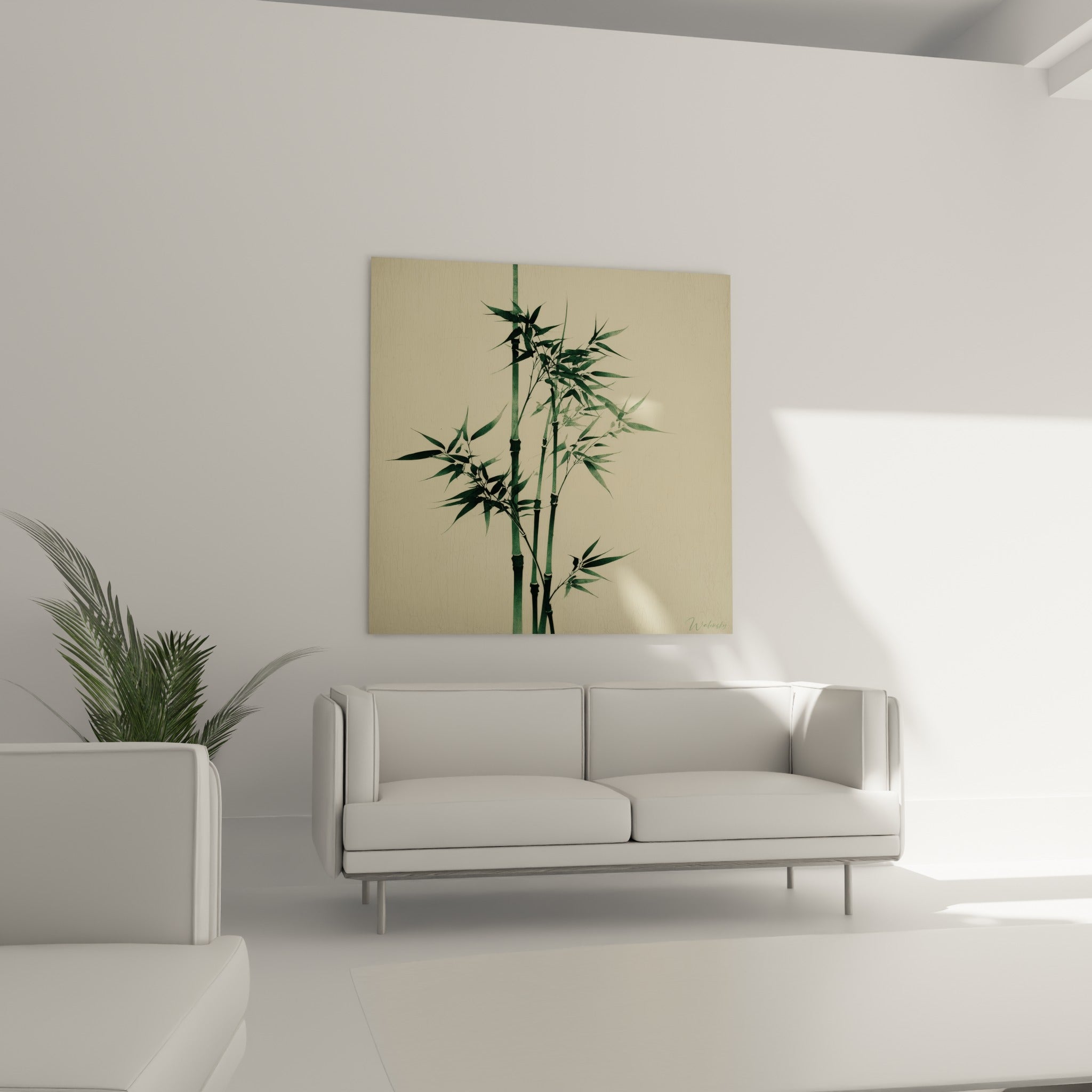 Feuillage de bambou vert sombre sur fond beige patiné, suspendu au-dessus d'un canapé dans un salon lumineux