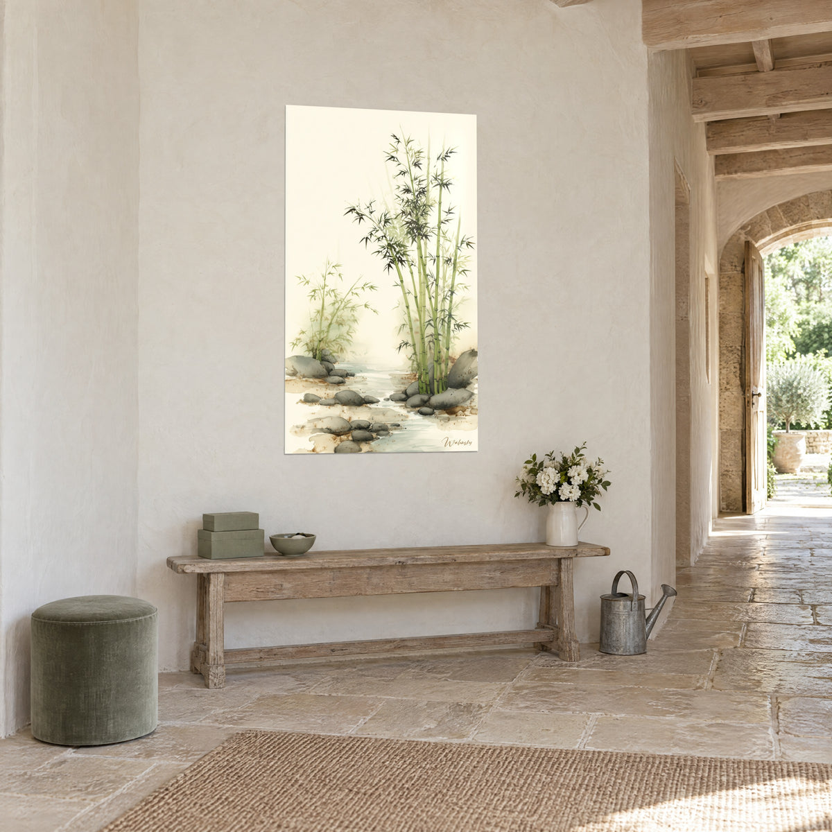 Wall art of olive green bamboo and dark foliage on an ivory background, gray pebbles, three-quarter view in a stone hallway