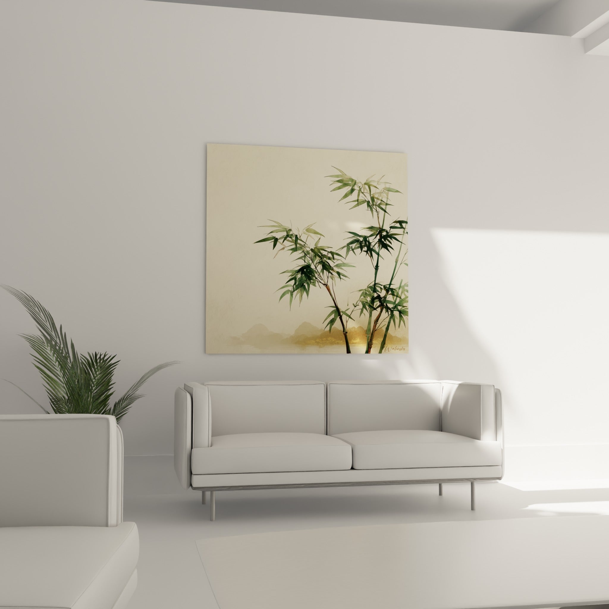 Feuillages de bambou vert sauge et touches dorées au-dessus d'un canapé dans un salon lumineux