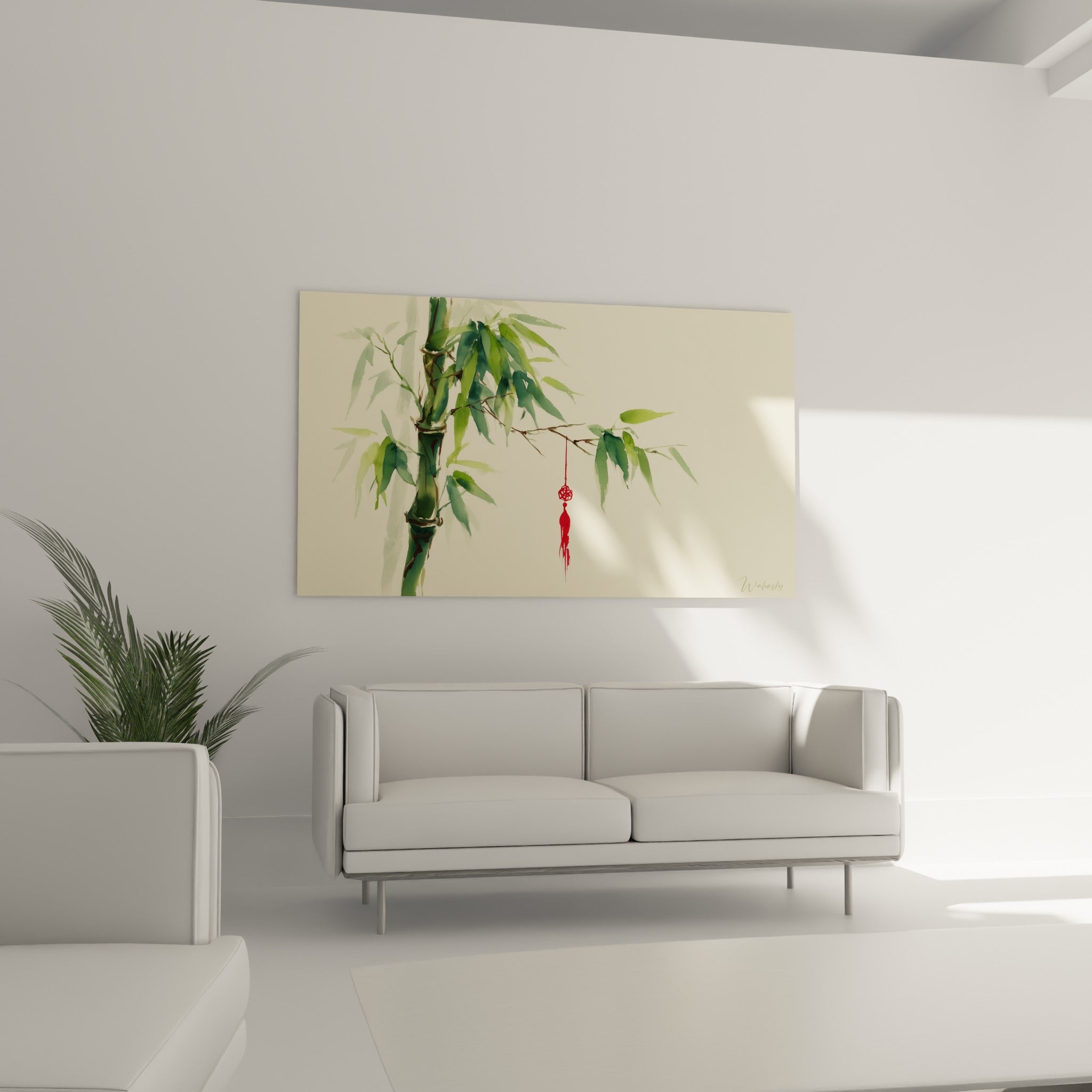 Feuillage de bambou vert sauge et pompon écarlate suspendus au-dessus d'un canapé dans un salon lumineux
