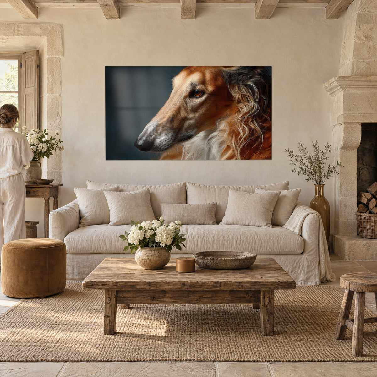 Wall art of a borzoi in profile, slender russet and cream muzzle, amber eye, blue-grey background, above a sofa in a bright living room