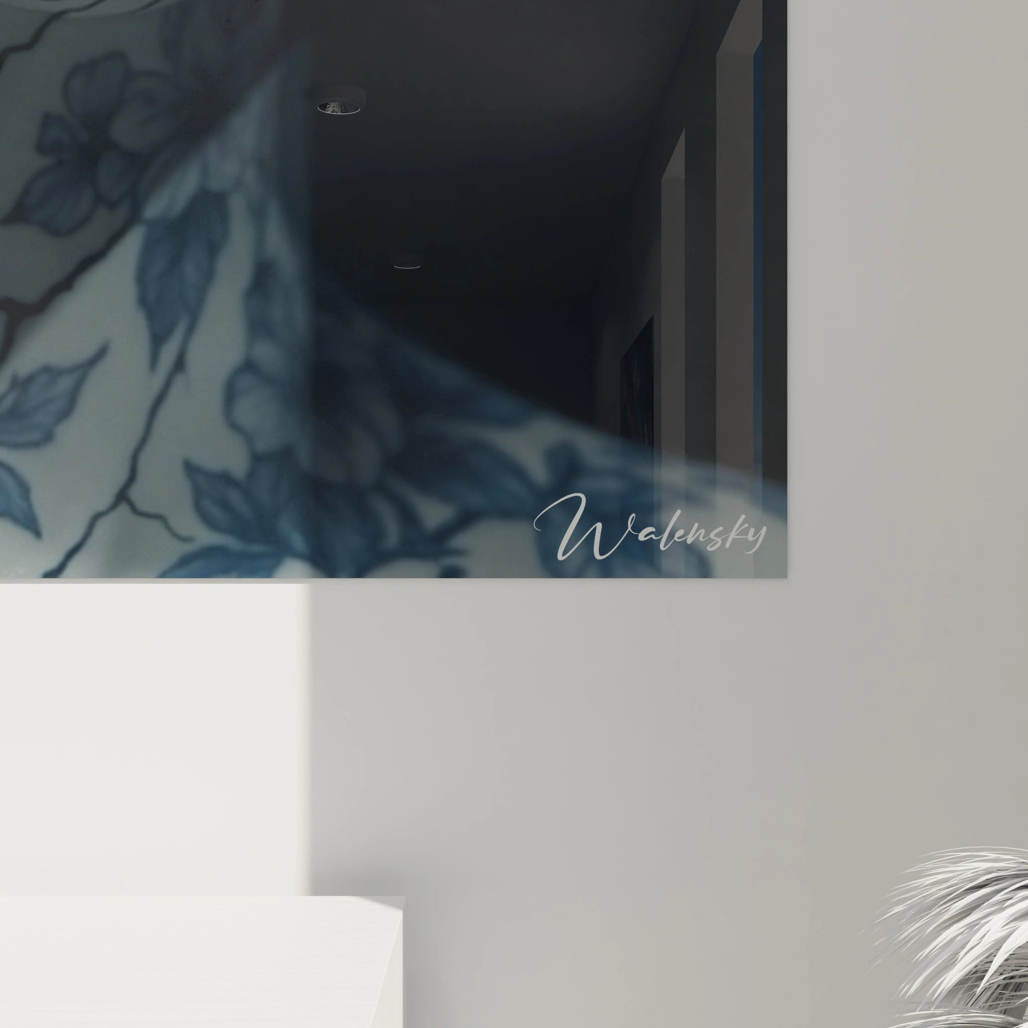 A porcelain wall art featuring a human head transformed into a ceramic art object. Blue floral patterns decorate the white surface of the closed-eyed face, crossed by crackle lines evoking the crackling of antique porcelain, against an intense black background.