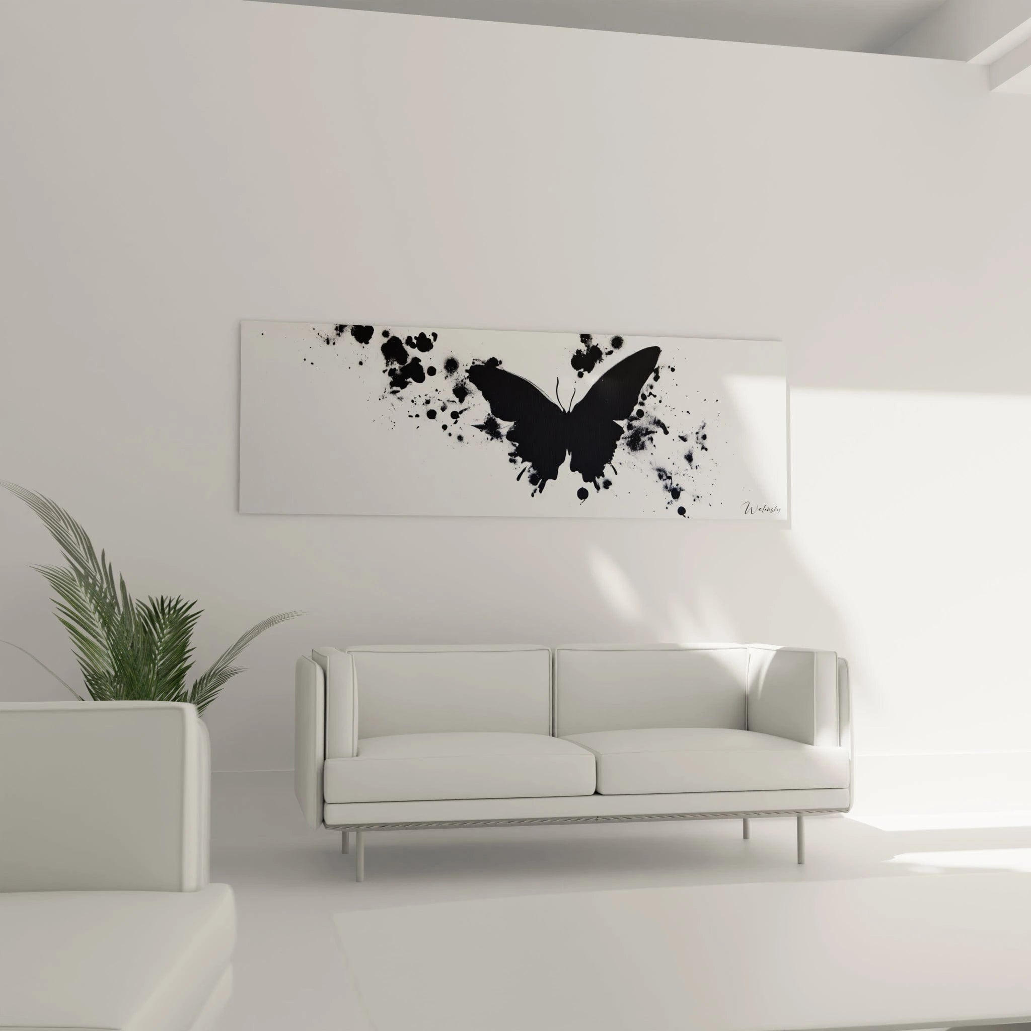 Tableau papillon noir Walensky sur un mur blanc dans un salon moderne avec canapé