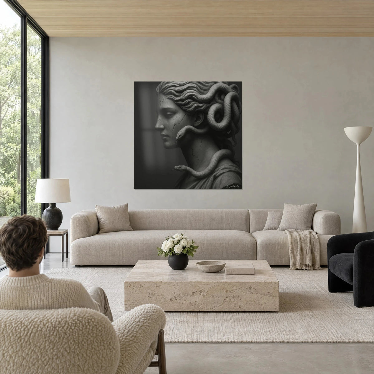 Wall art profile of a cracked statue, snakes coiled in the grey curls, anthracite background, above a sofa in a bright living room