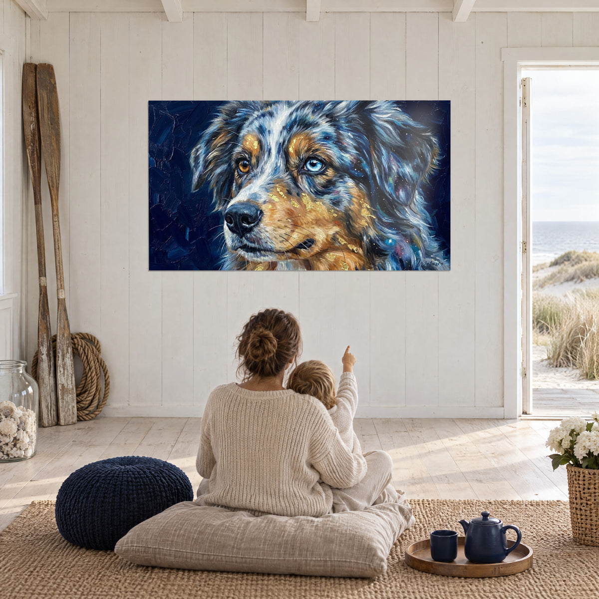 Wall art shepherd with starry blue and copper coat, a mother and child seated from behind on cushions facing the sea