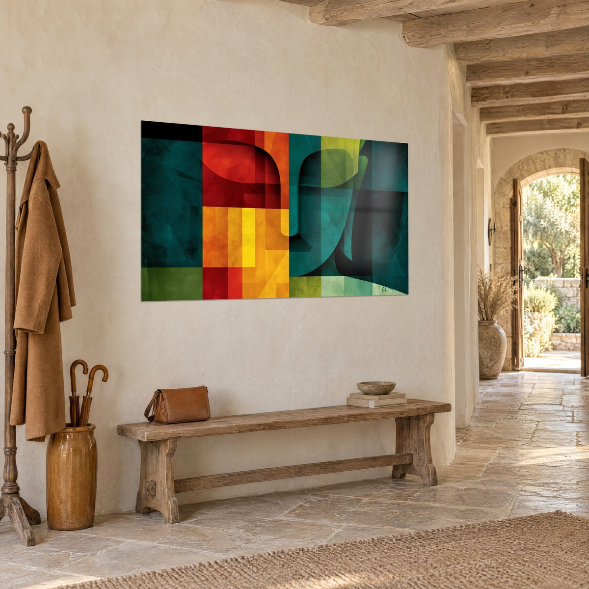 Tableau mosaïque de carrés orange, jaune et vert sapin dessinant un profil stylisé, mur crépi, banc de bois, arche en pierre