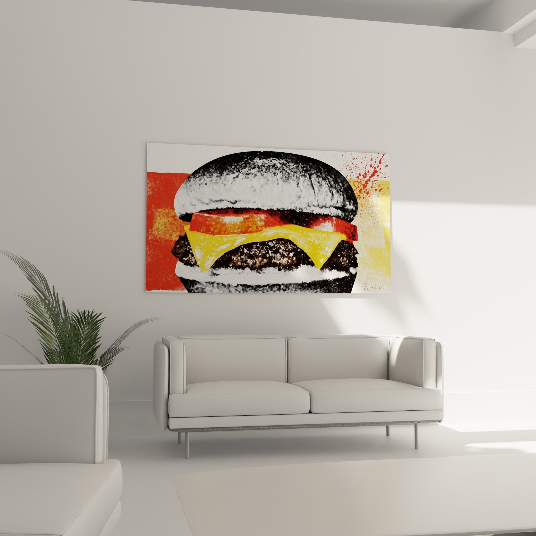 Burger noir et blanc éclaboussé de rouge suspendu au-dessus d'un canapé dans un salon lumineux