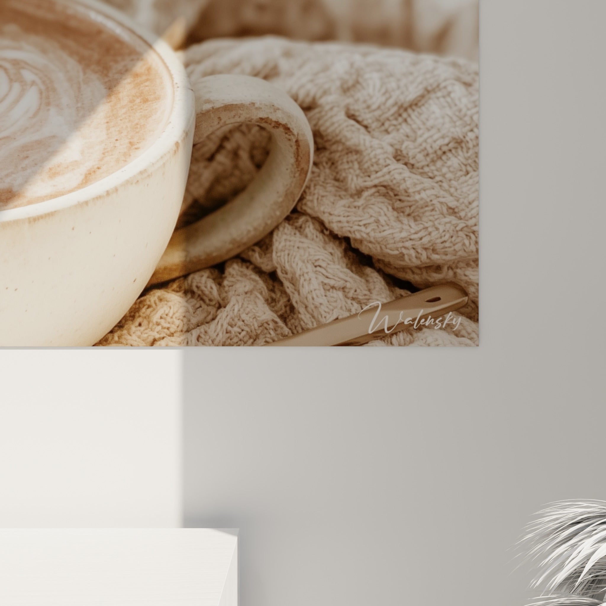 Grain de l'impression révélant les nuances crème et terracotta de la mousse de café et la texture du plaid tricoté