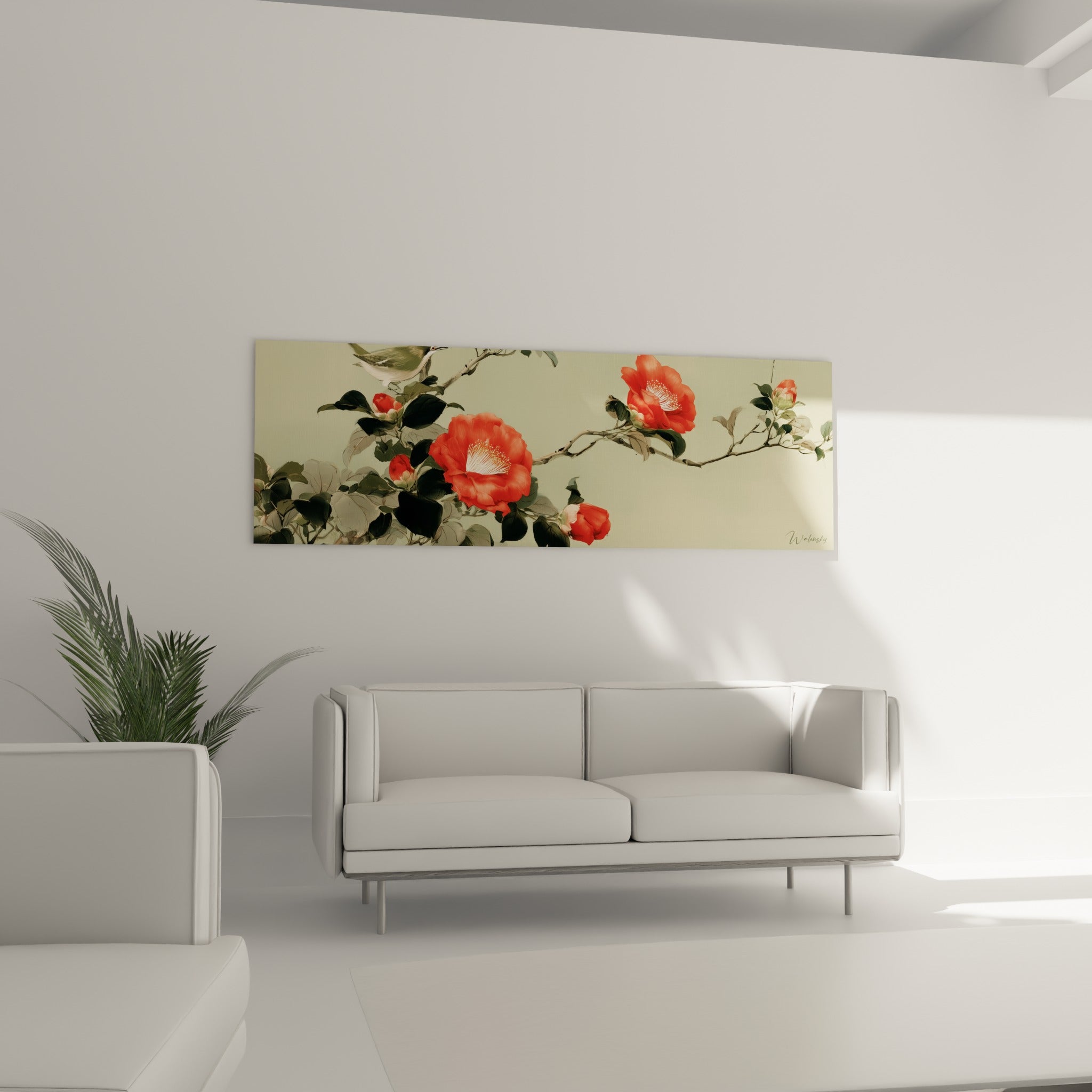 Fleurs de camélia rouge vif et feuillage anthracite déployés au-dessus d'un canapé dans un salon lumineux