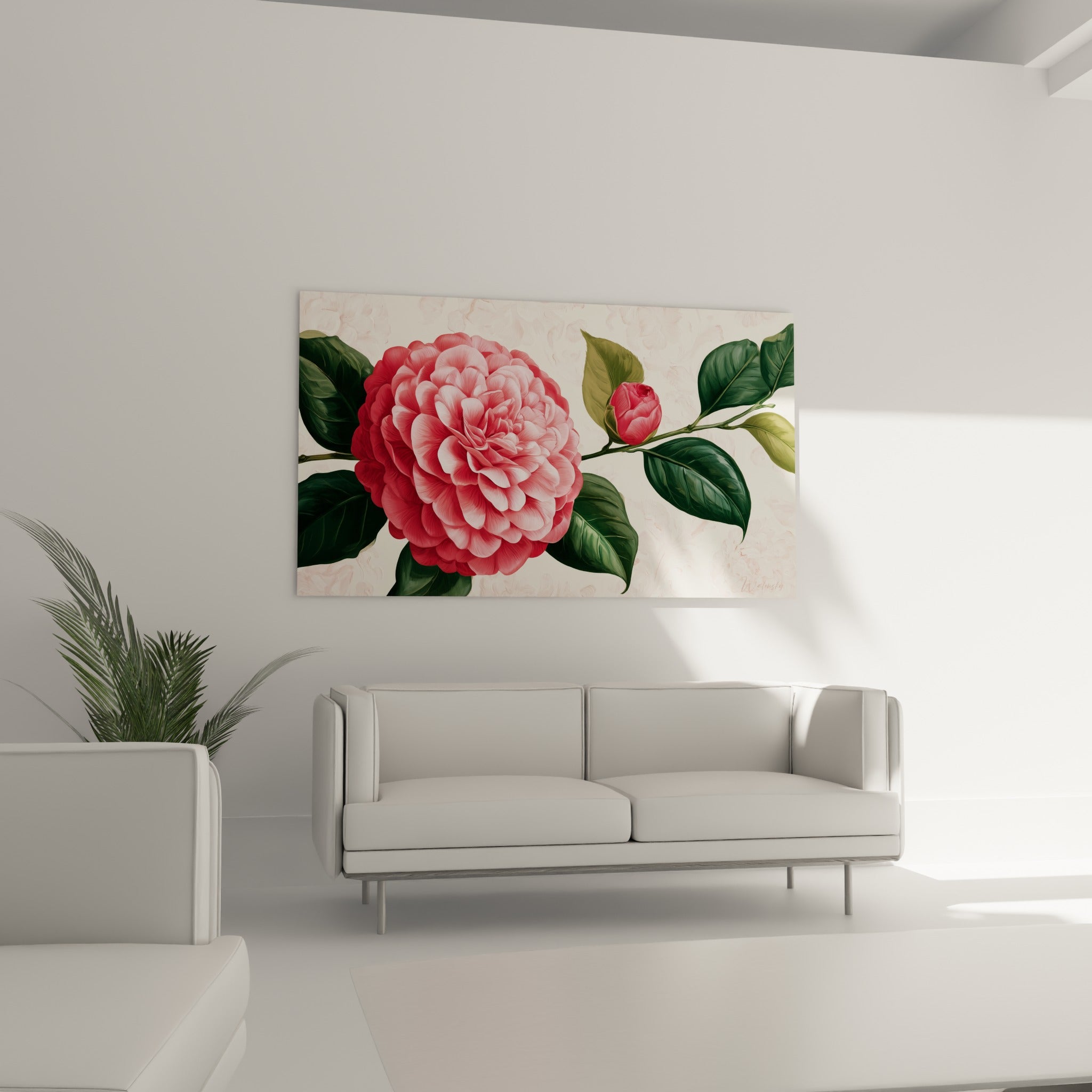 Corolle rose pâle et vert olive du camélia déployée au-dessus d'un canapé dans un salon lumineux