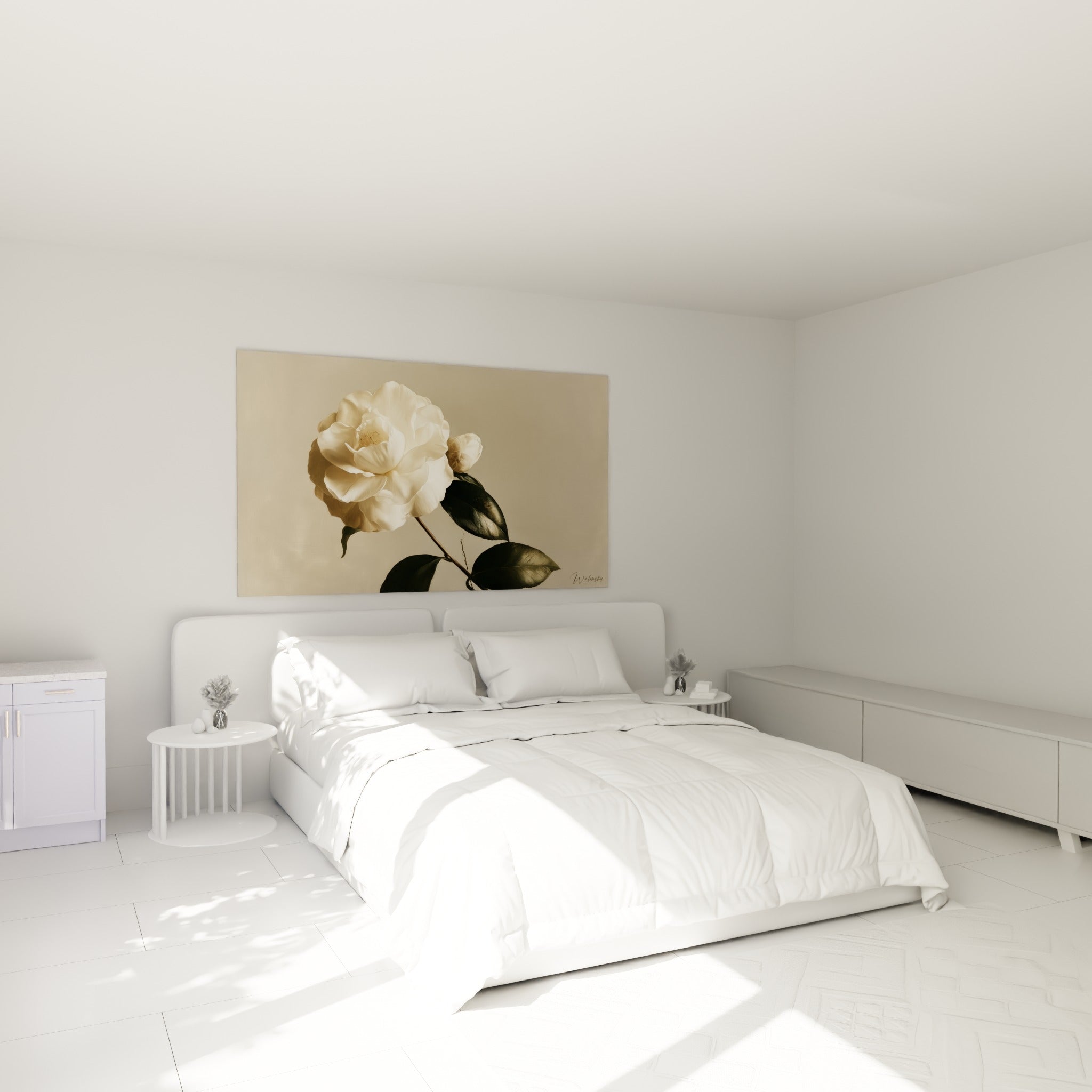 Fleur de camélia crème et anthracite au-dessus d'un lit dans une chambre claire
