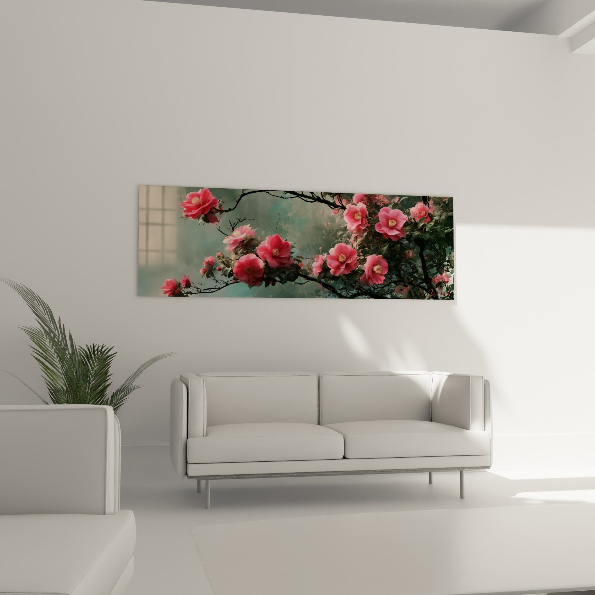 Fleurs de camélia rose vif sur fond vert brumeux, disposées au-dessus d'un canapé dans un salon lumineux