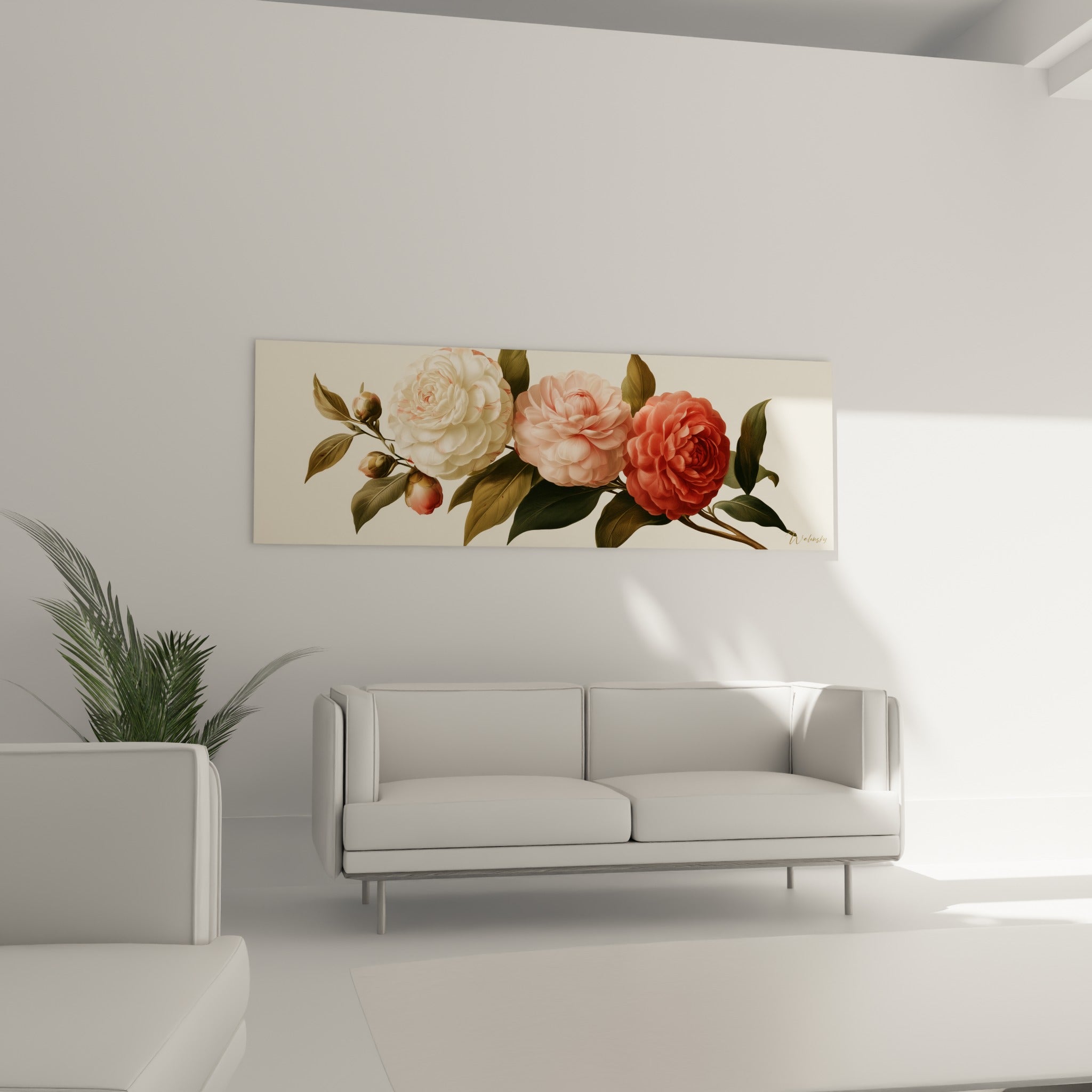 Trois camélias aux teintes ivoire, rose et rouge accrochés au-dessus d'un canapé dans un salon lumineux