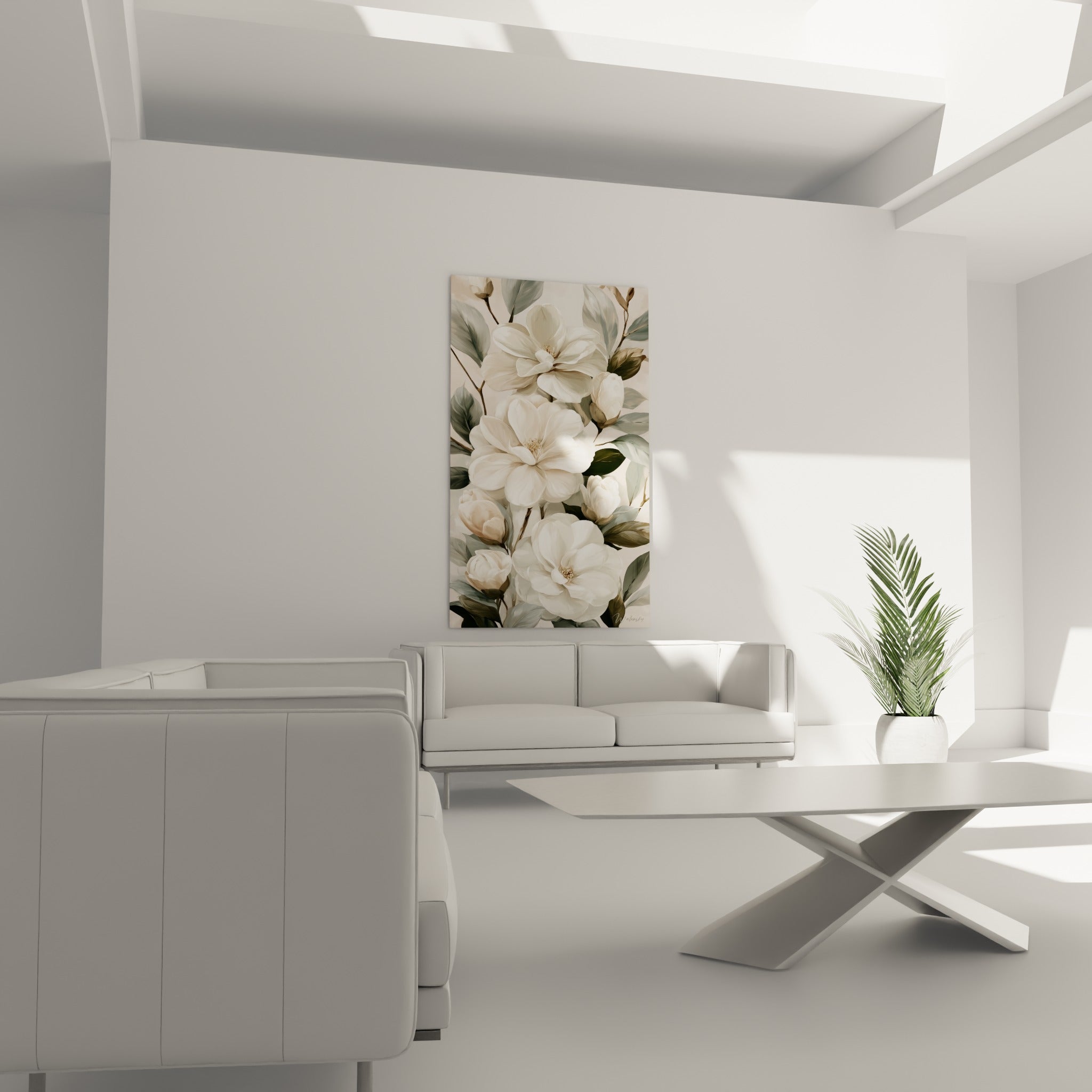 Fleurs de camélia blanches et feuillage sauge suspendues au-dessus d'un canapé dans un salon lumineux