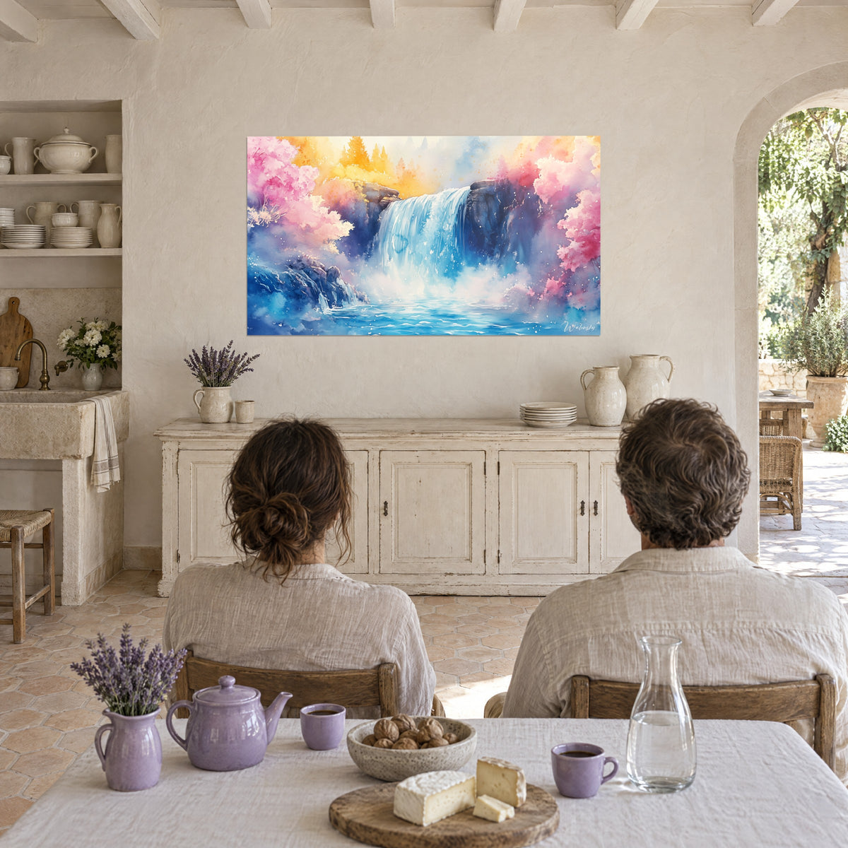 Wall art river gushing from a dark rock, cyan blue pool, pink cherry trees, couple seen from behind seated at a table in a country farmhouse