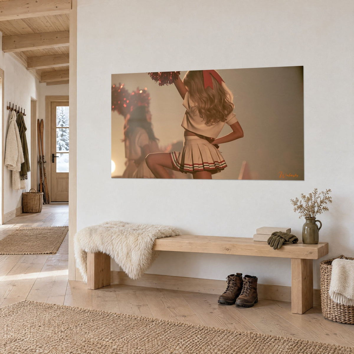 Wall art cheerleader in a cream pleated skirt with red piping, raised arm holding a sparkling red pom-pom, hung in a chalet entryway