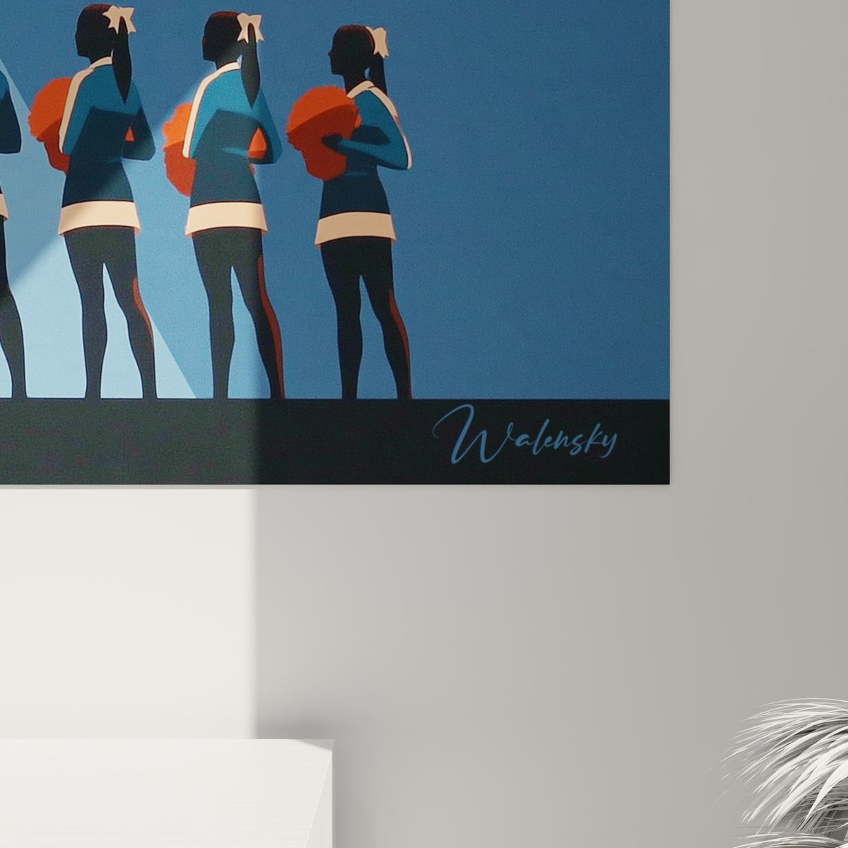 Détail de la silhouette bleu marine et du pompon orange texturé, grain de l'impression visible sur l'œuvre encadrée