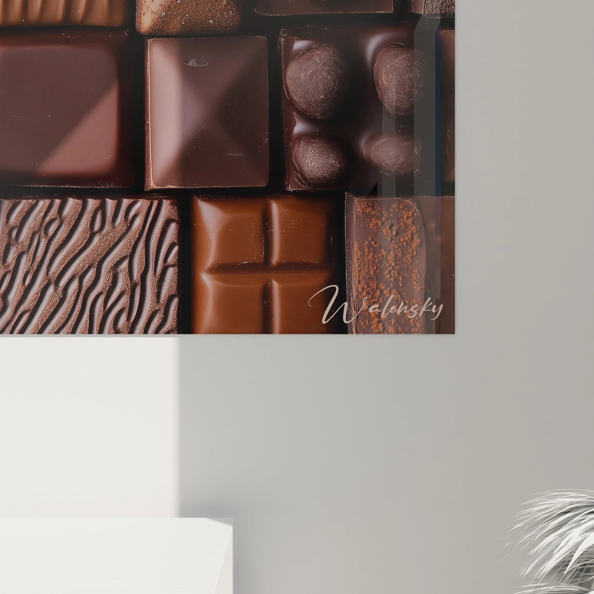 Un tableau chocolat composé de formes carrées aux teintes marron et bronze, avec des textures variées incluant des stries, des éclats et des surfaces lisses, évoquant des motifs de chocolats artisanaux.