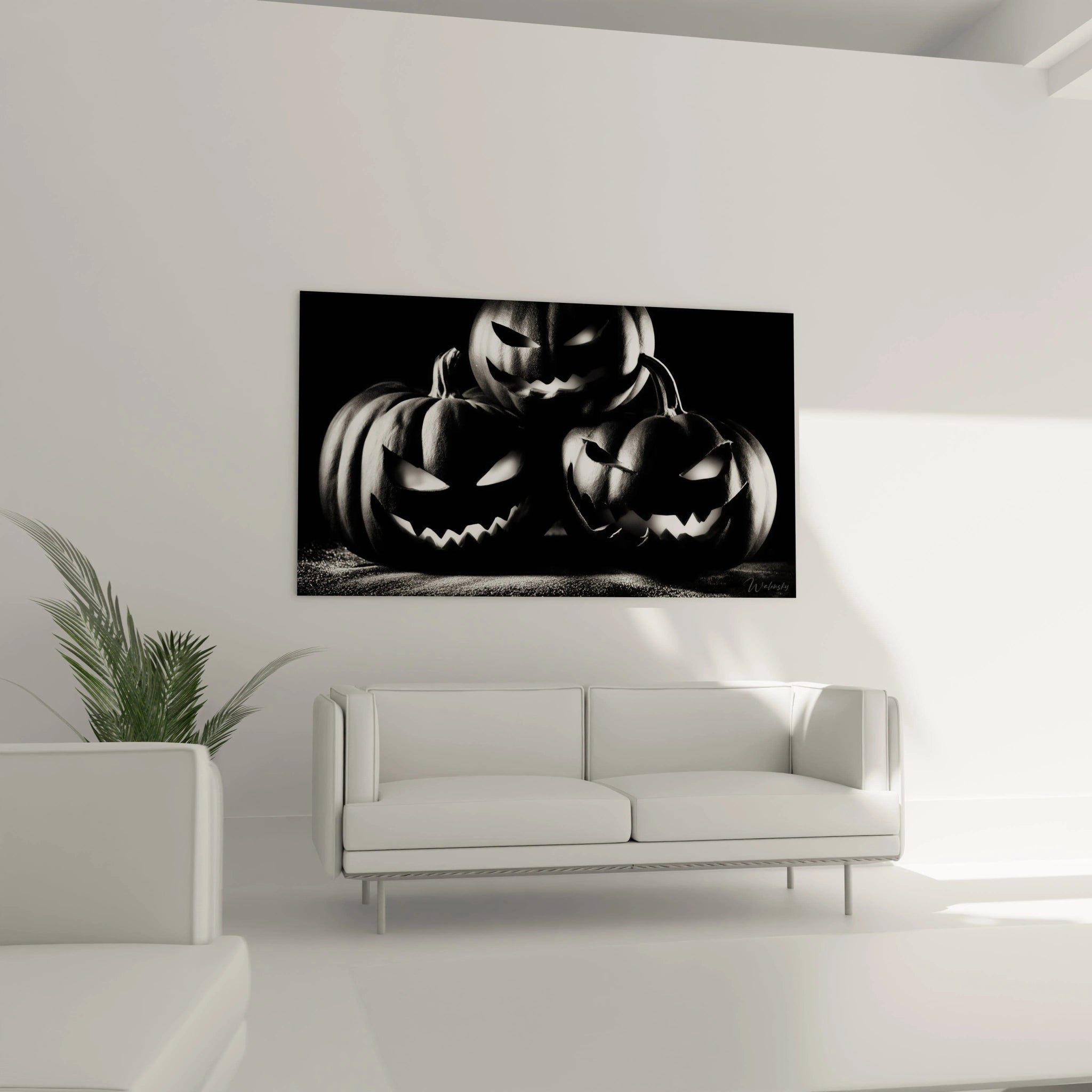 Tableau mural trois citrouilles sculptées menaçantes au-dessus d'un canapé tableau halloween citrouille