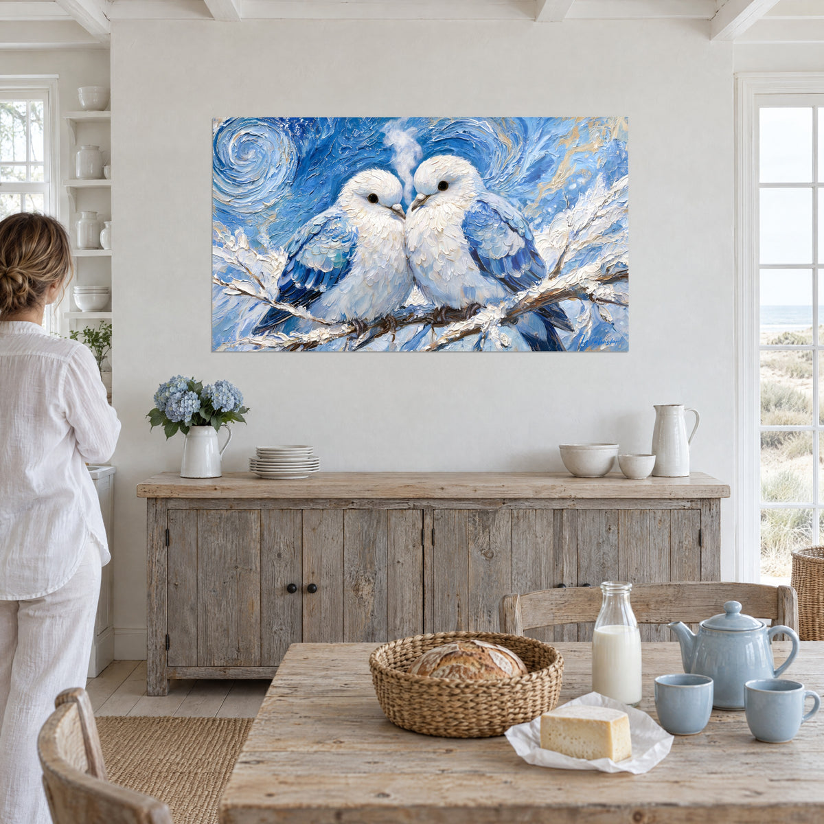 Tableau deux oiseaux ivoire front contre front, branche enneigée brune, tourbillons bleus, près d'une table de cuisine