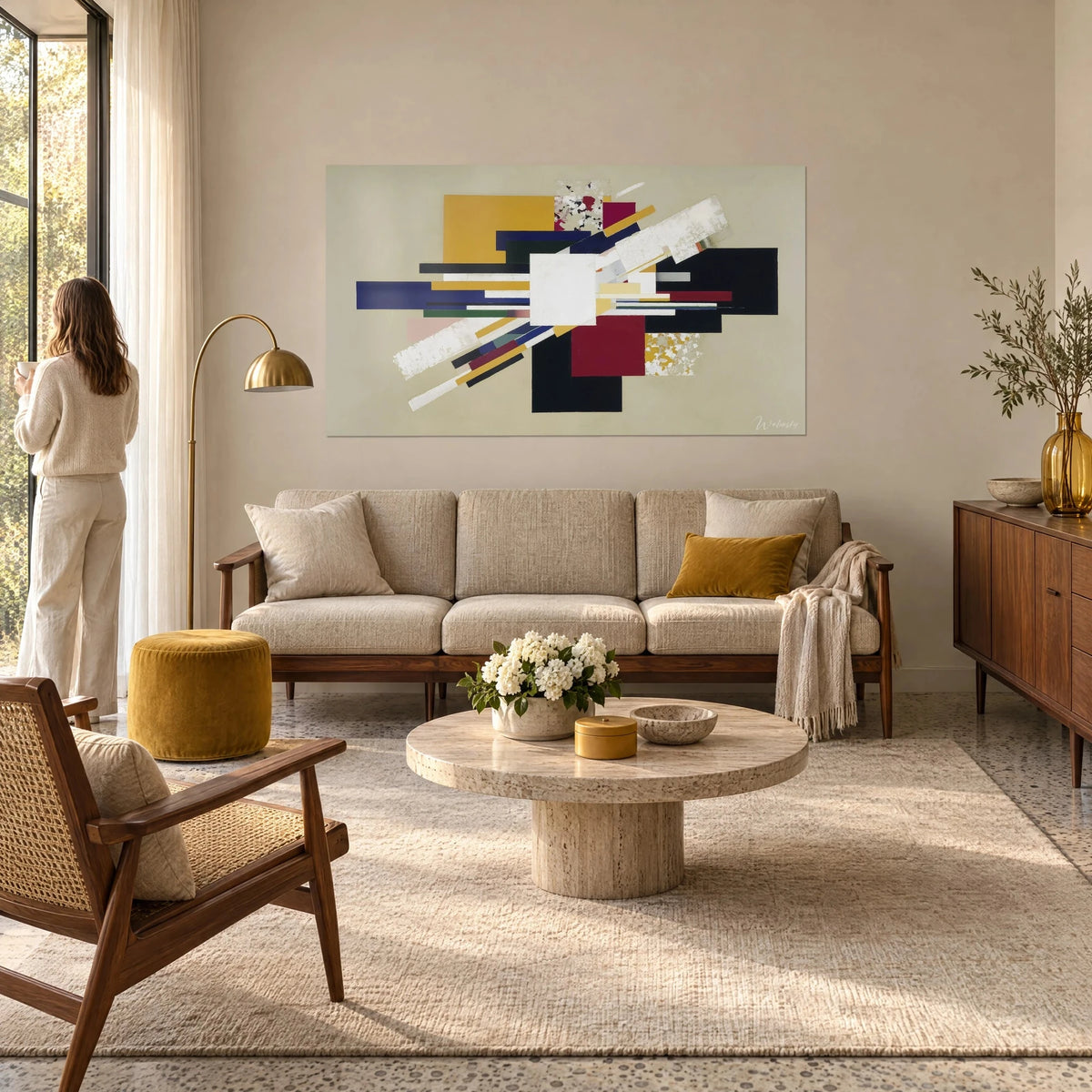 Wall art geometric composition of ochre, burgundy and midnight blue rectangles, diagonal white bands, above a sofa in a bright living room