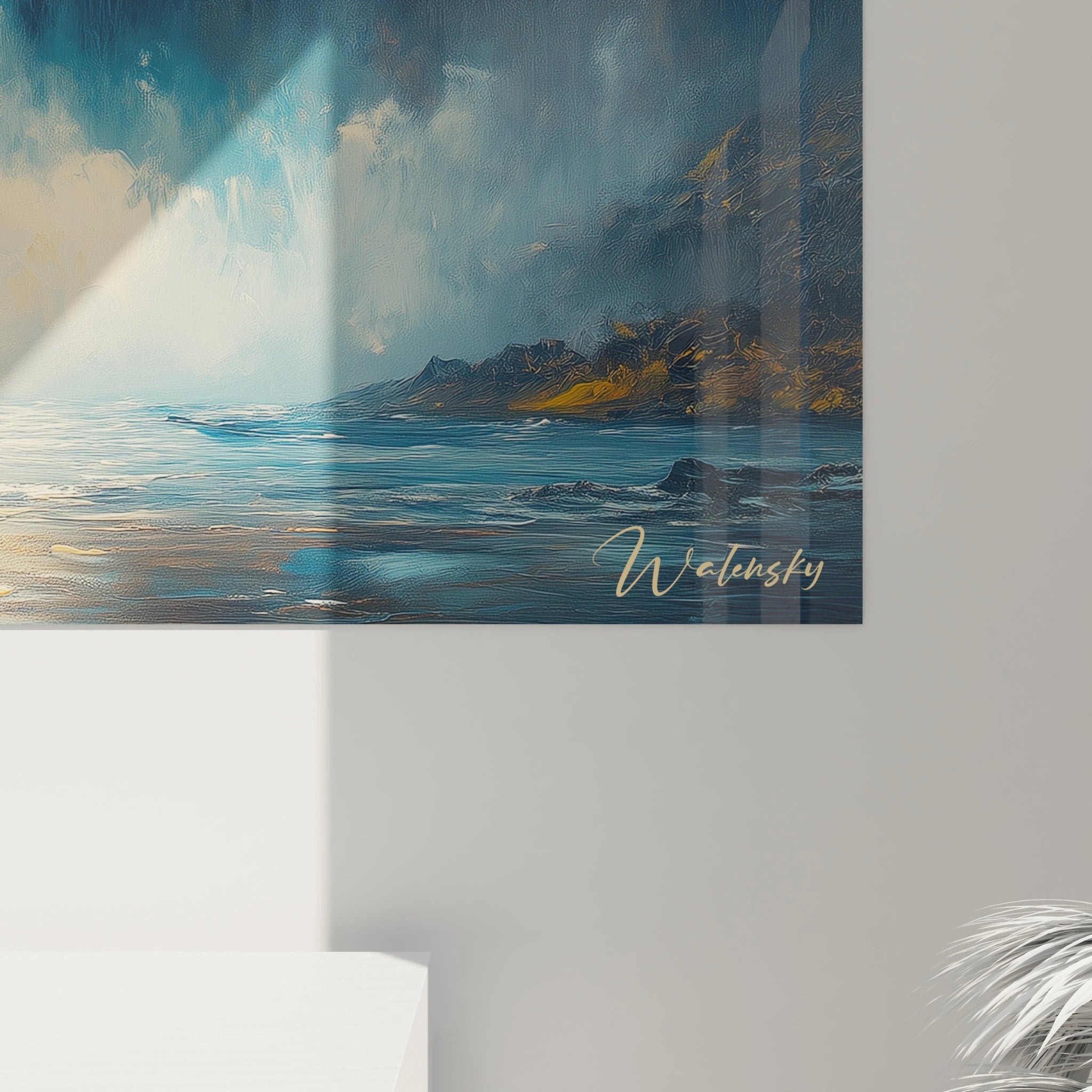 Tableau cascade montrant une impressionnante chute d'eau encadrée par des formations rocheuses sombres, sous un ciel embrasé de couleurs chaudes, où l'eau prend des teintes bleu turquoise en tombant dans un bassin entouré de rochers texturés au premier plan.