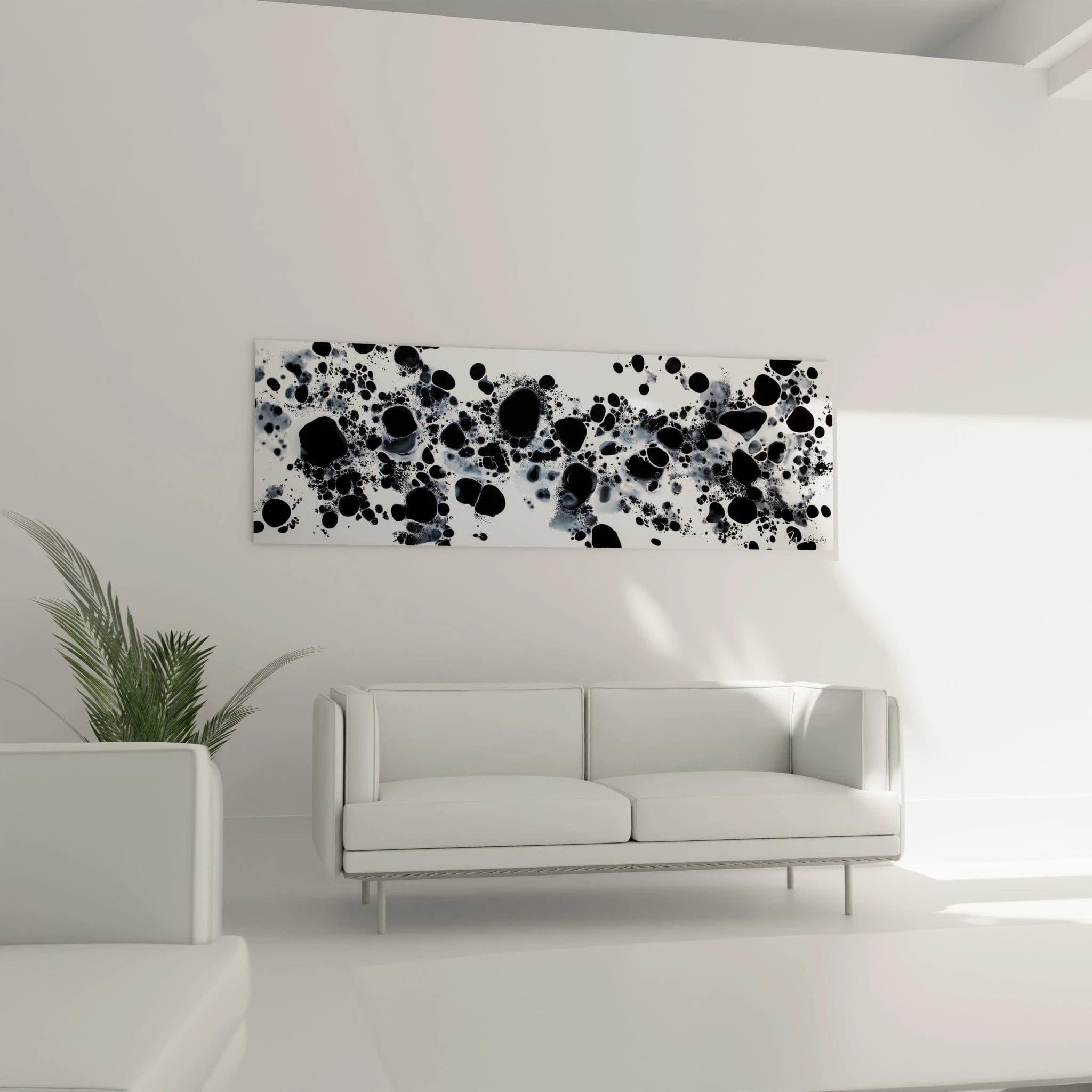 Tableau tacheté noir et blanc Walensky accroché dans un salon moderne avec un canapé blanc