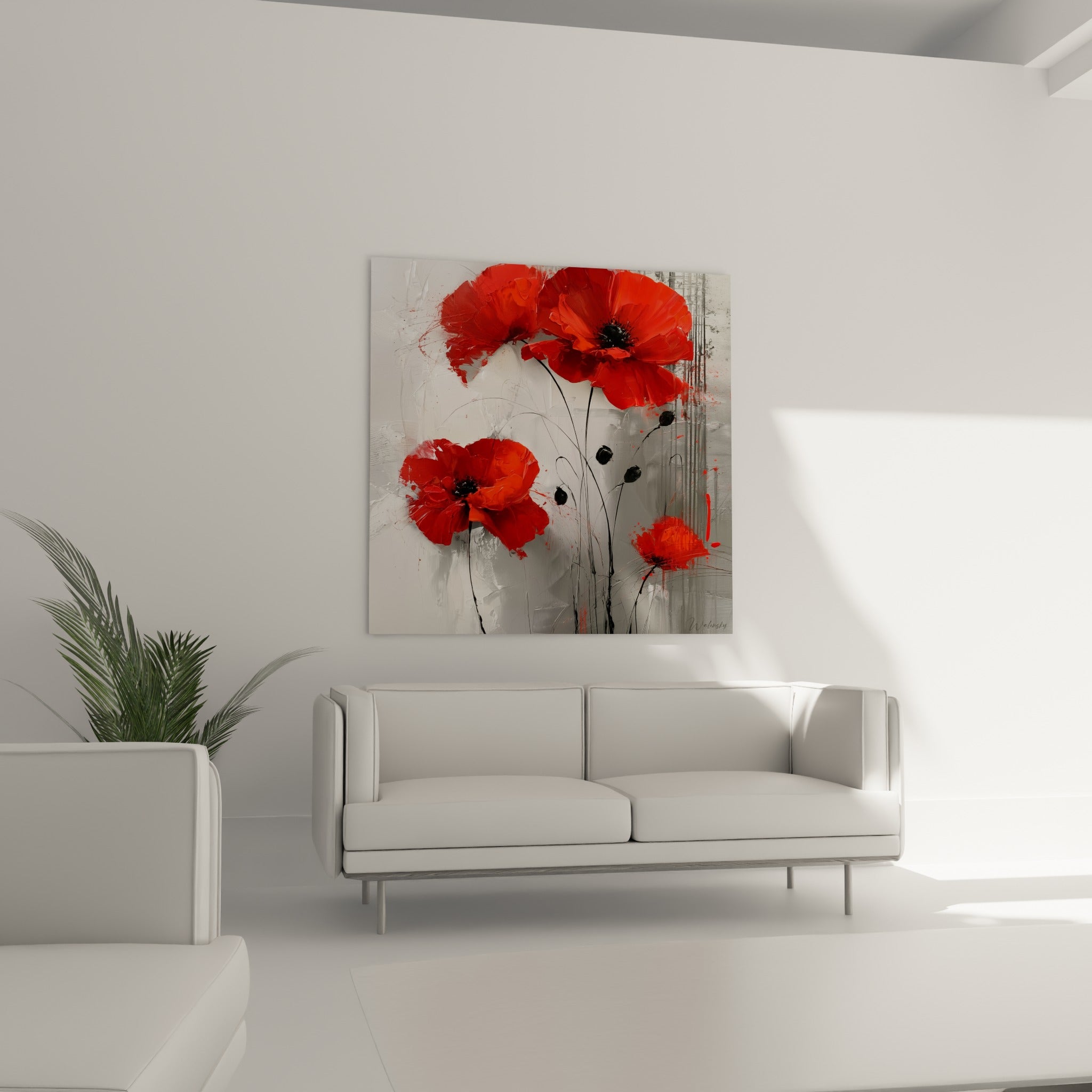 Fleurs rouges éclatantes sur fond anthracite disposées au-dessus d'un canapé dans un salon lumineux